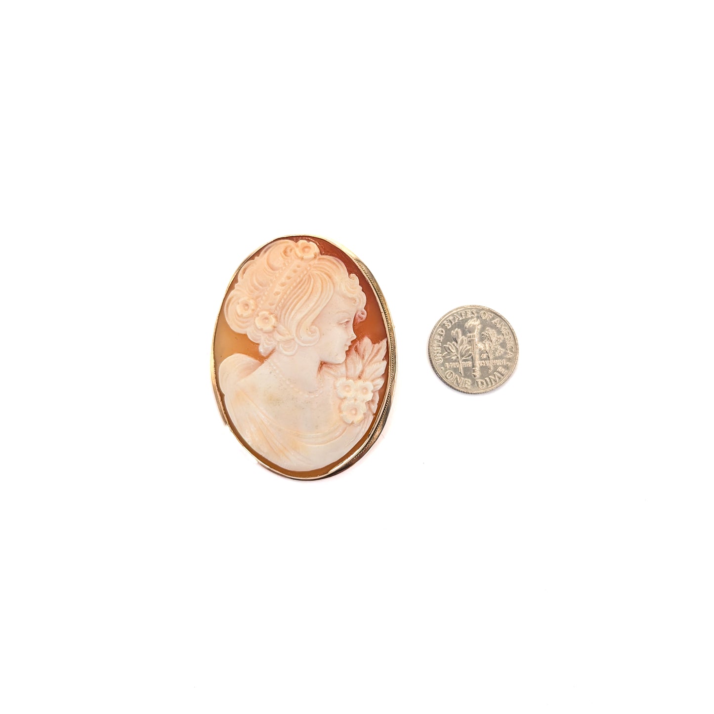 9k gold cameo brooch with a classical design on a white background