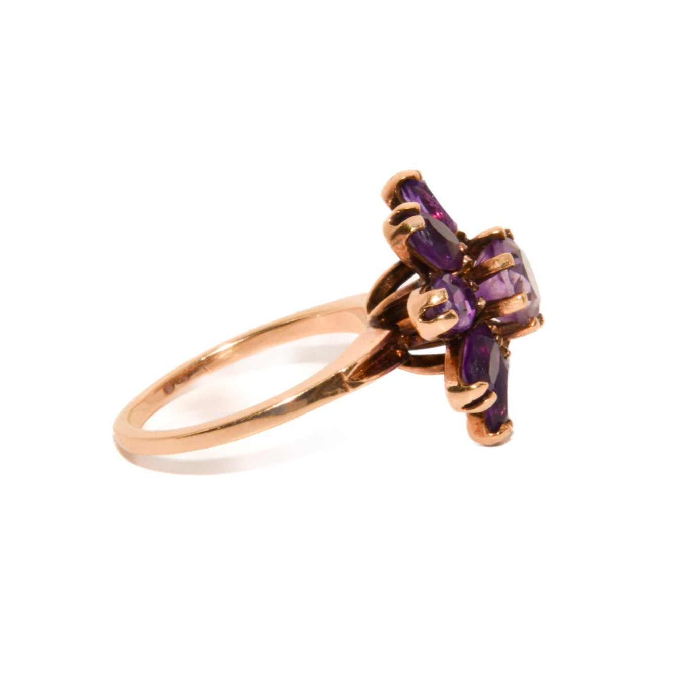Vintage 14k Gold Amethyst Cluster Ring. Featuring a striking arrangement of deep purple amethysts, this bold ring demands attention with its vibrant purple tones and intricate craftsmanship.