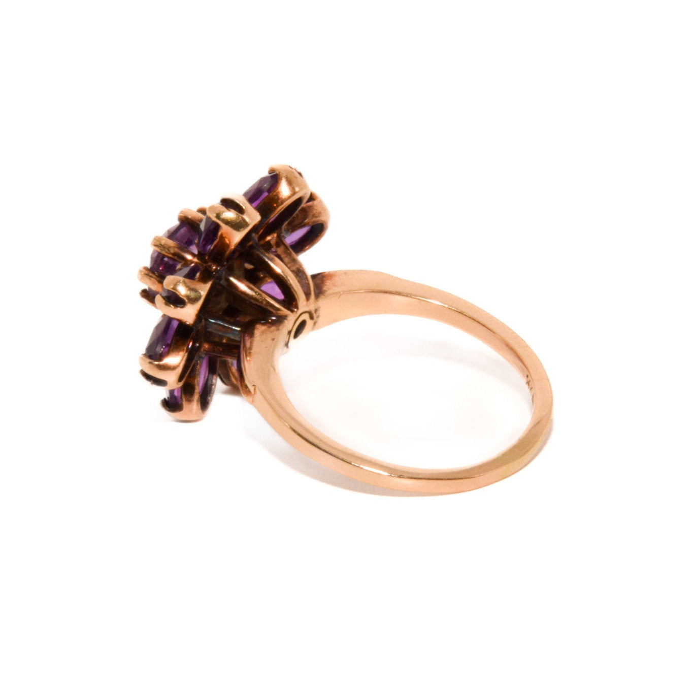 Vintage 14k Gold Amethyst Cluster Ring. Featuring a striking arrangement of deep purple amethysts, this bold ring demands attention with its vibrant purple tones and intricate craftsmanship.