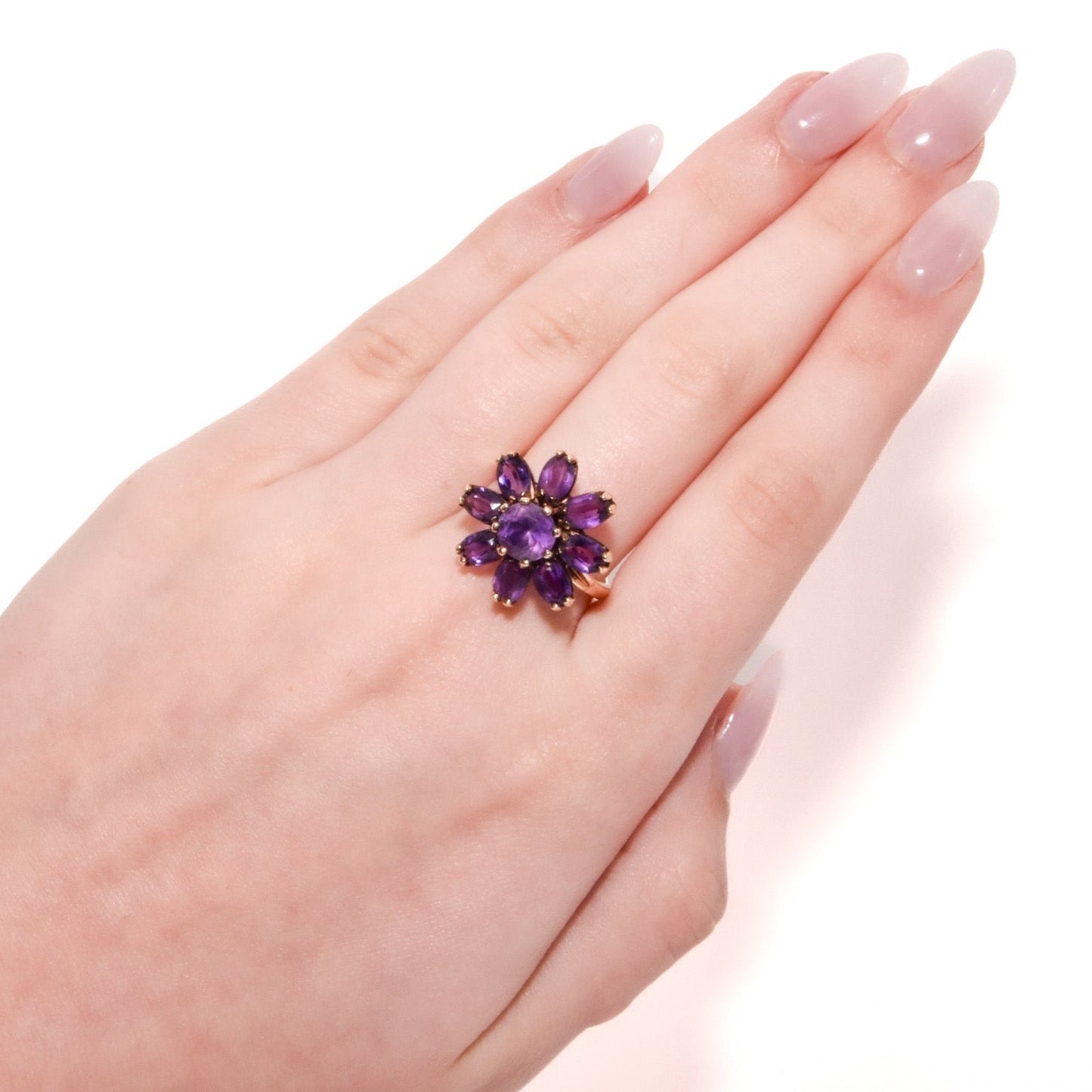 Vintage 14k Gold Amethyst Cluster Ring. Featuring a striking arrangement of deep purple amethysts, this bold ring demands attention with its vibrant purple tones and intricate craftsmanship.
