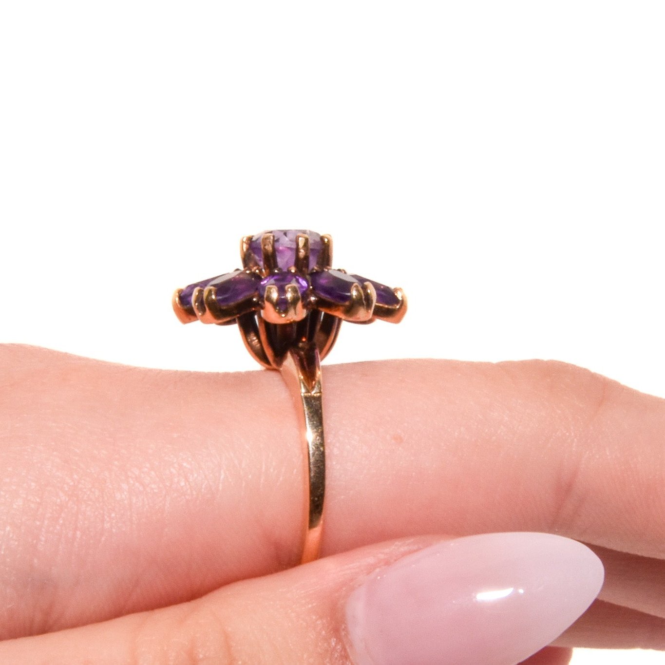 Vintage 14k Gold Amethyst Cluster Ring. Featuring a striking arrangement of deep purple amethysts, this bold ring demands attention with its vibrant purple tones and intricate craftsmanship.