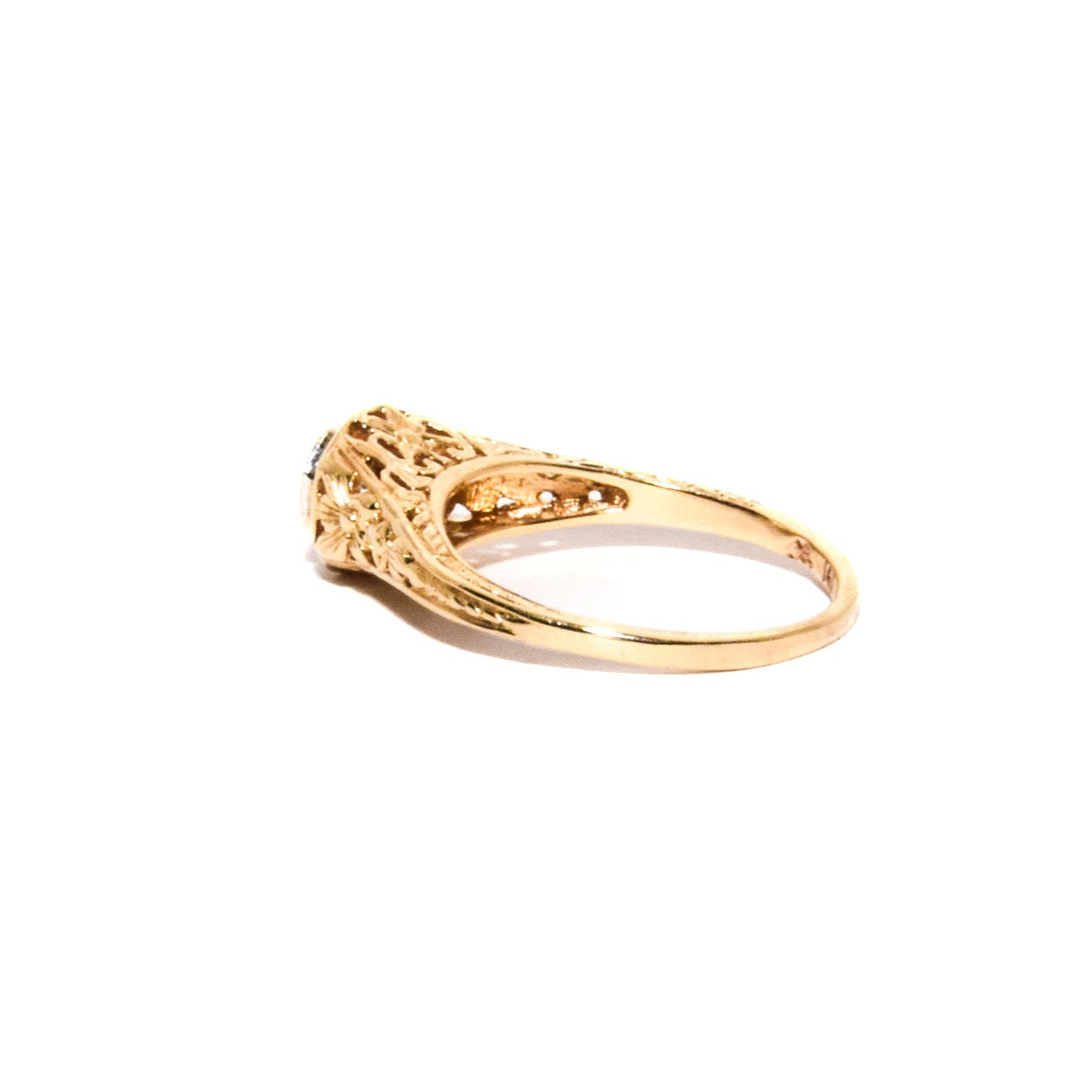 Antique Art Deco Diamond Filigree Ring. Featuring a dazzling diamond amidst an intricately detailed filigree design.