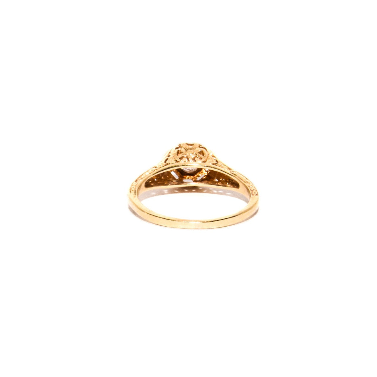 Antique Art Deco Diamond Filigree Ring. Featuring a dazzling diamond amidst an intricately detailed filigree design.