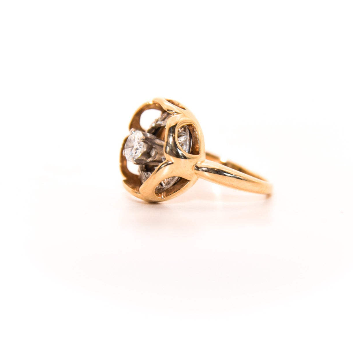 Vintage Diamond Ring, Where an Art Deco-era piece (once an earring or pendant!) finds new life. Featuring a stunning geometric design crafted with inspiration of this era's unmistakable flair, this ring showcases a central diamond surrounded by intricate patterns of smaller diamonds, creating a captivating display of light and brilliance.