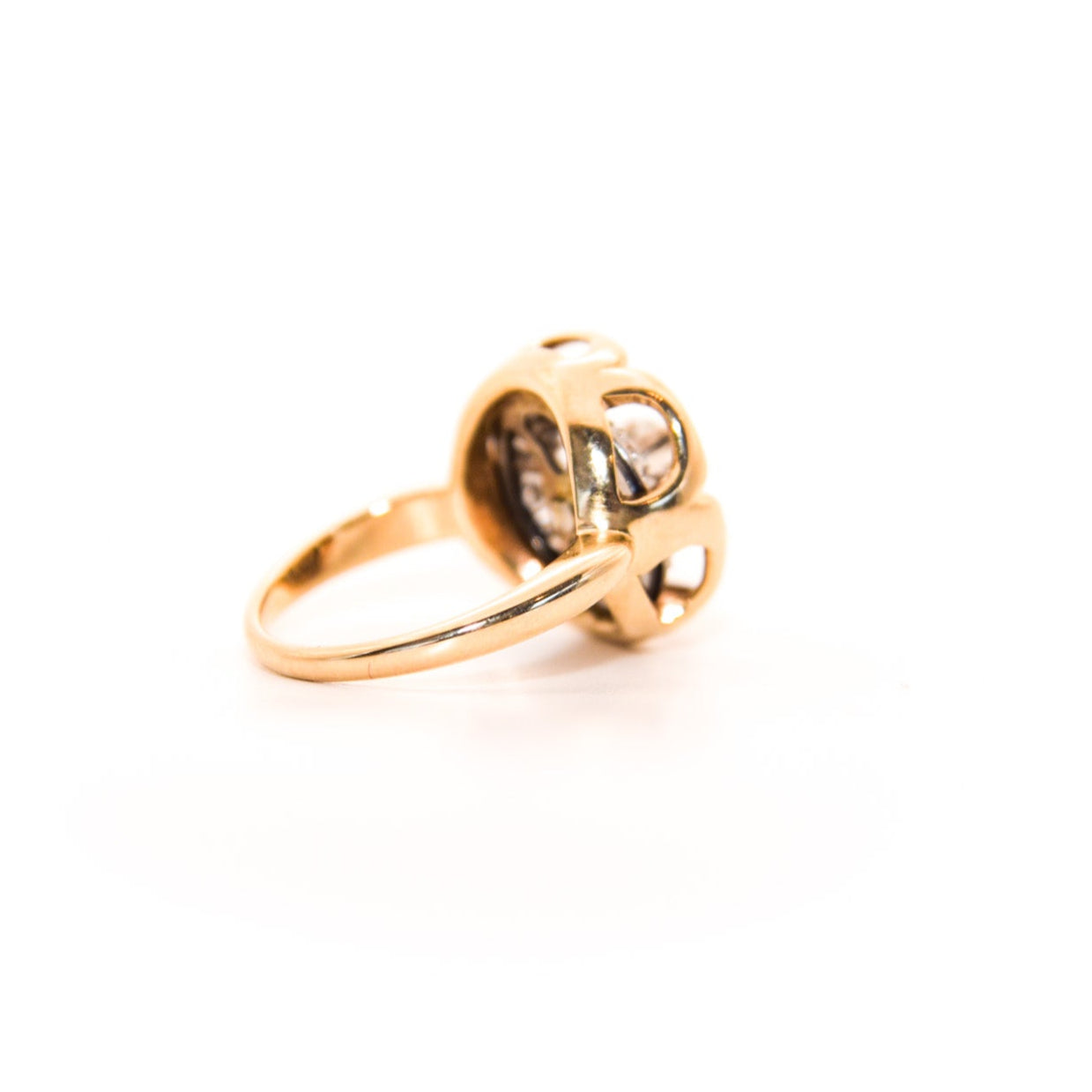 Vintage Diamond Ring, Where an Art Deco-era piece (once an earring or pendant!) finds new life. Featuring a stunning geometric design crafted with inspiration of this era's unmistakable flair, this ring showcases a central diamond surrounded by intricate patterns of smaller diamonds, creating a captivating display of light and brilliance.