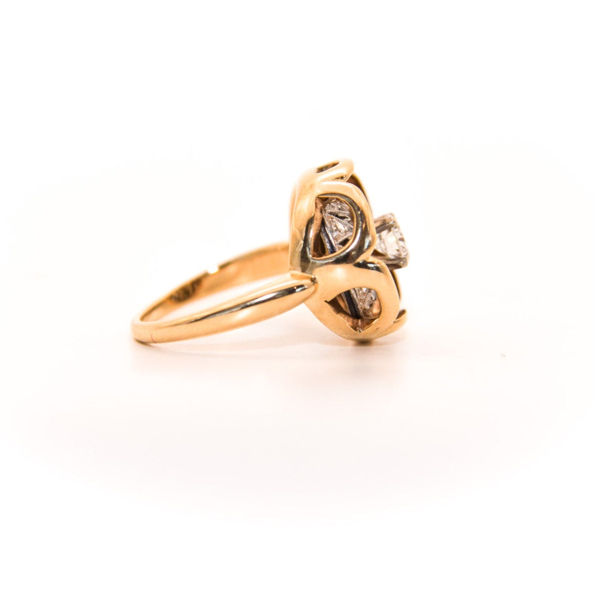Vintage Diamond Ring, Where an Art Deco-era piece (once an earring or pendant!) finds new life. Featuring a stunning geometric design crafted with inspiration of this era's unmistakable flair, this ring showcases a central diamond surrounded by intricate patterns of smaller diamonds, creating a captivating display of light and brilliance.