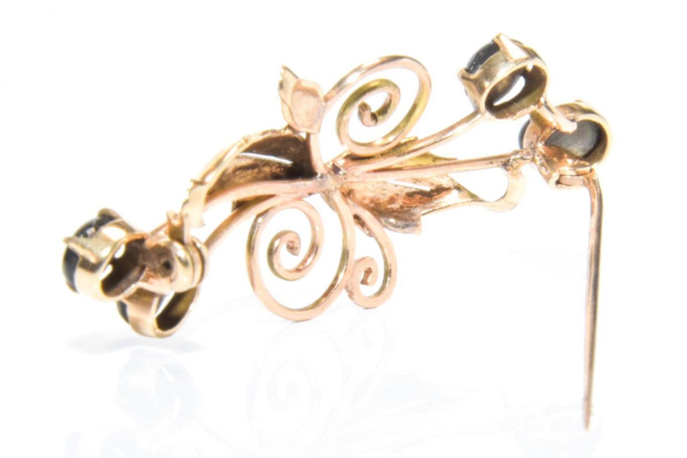 Vintage 14K Gold Floral Brooch with Black Star Sapphire Cabochons