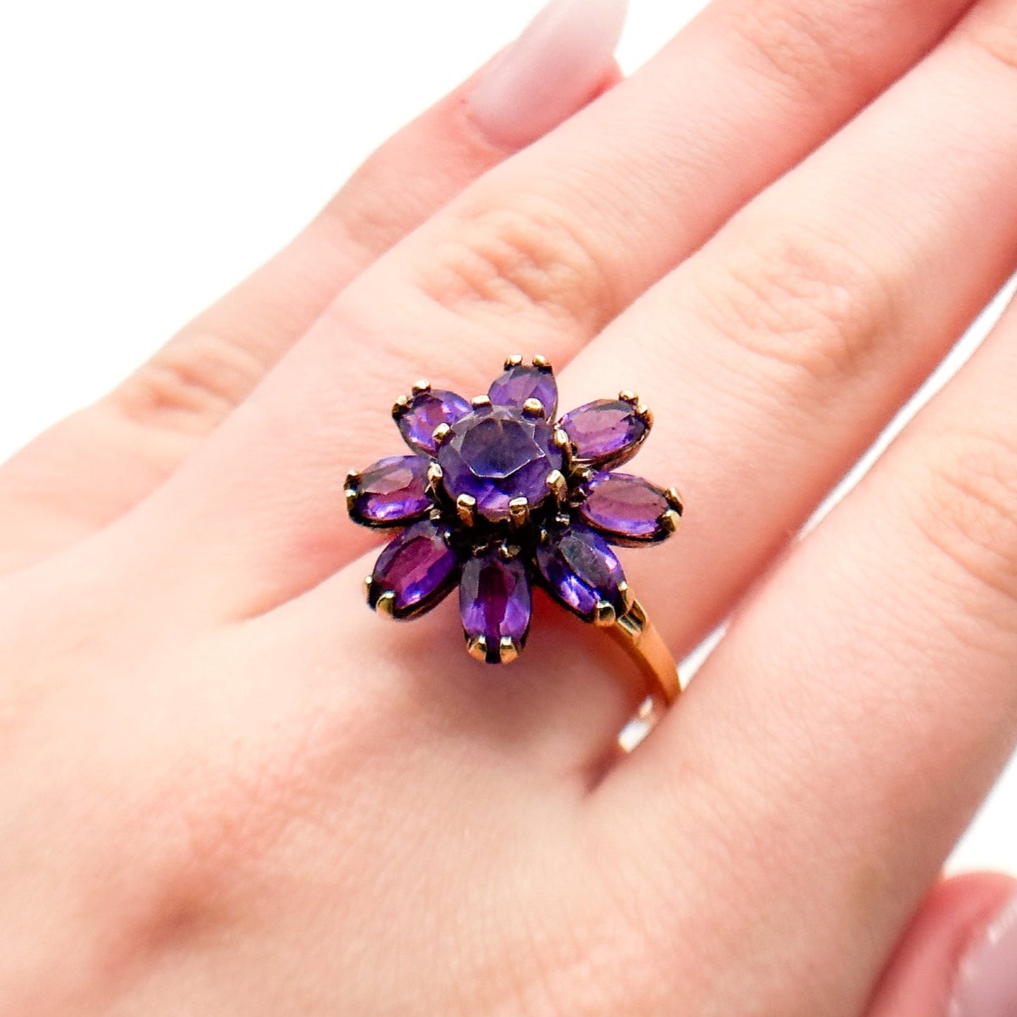 Vintage 14k Gold Amethyst Cluster Ring. Featuring a striking arrangement of deep purple amethysts, this bold ring demands attention with its vibrant purple tones and intricate craftsmanship.