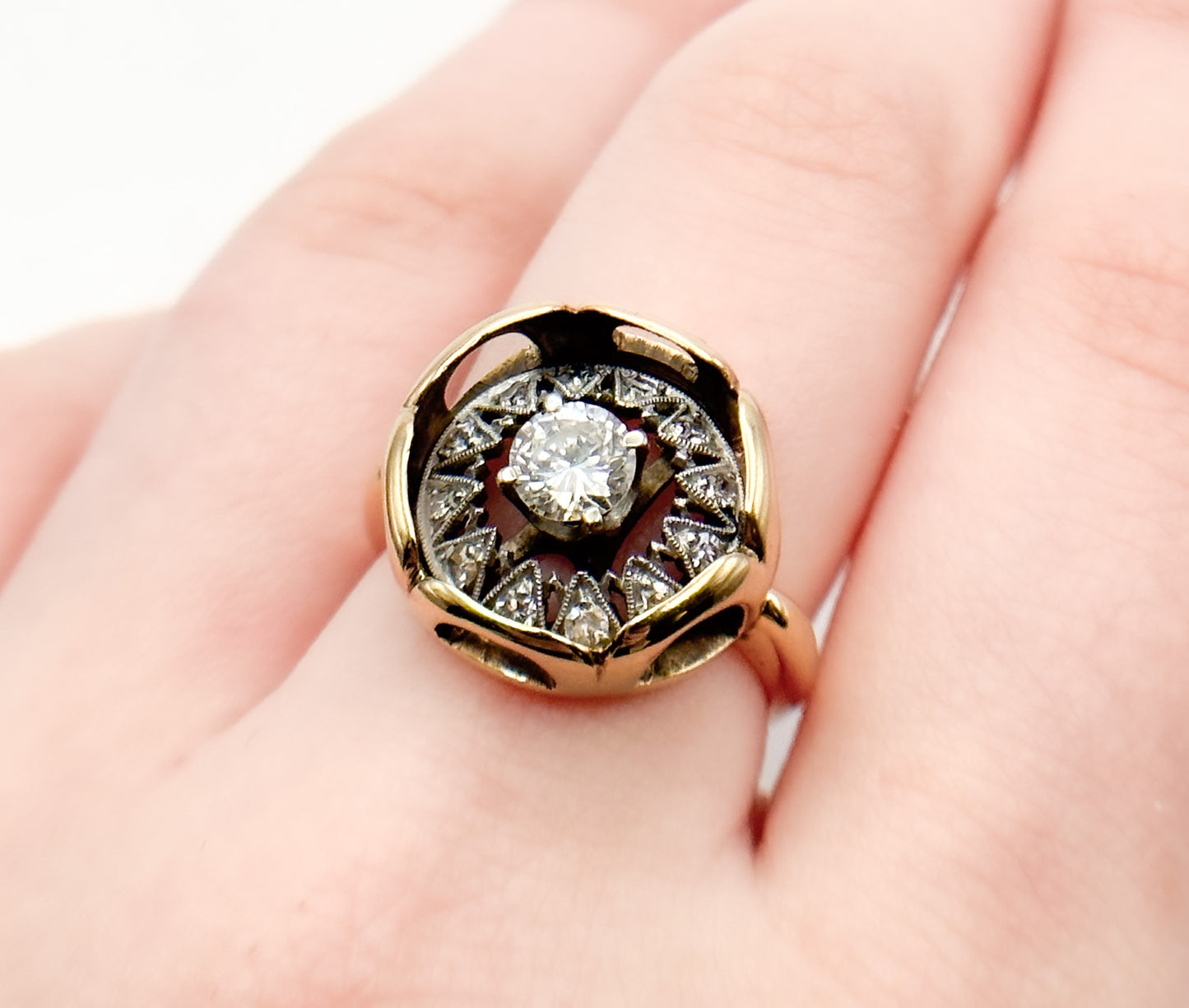 Vintage Diamond Ring, Where an Art Deco-era piece (once an earring or pendant!) finds new life. Featuring a stunning geometric design crafted with inspiration of this era's unmistakable flair, this ring showcases a central diamond surrounded by intricate patterns of smaller diamonds, creating a captivating display of light and brilliance.
