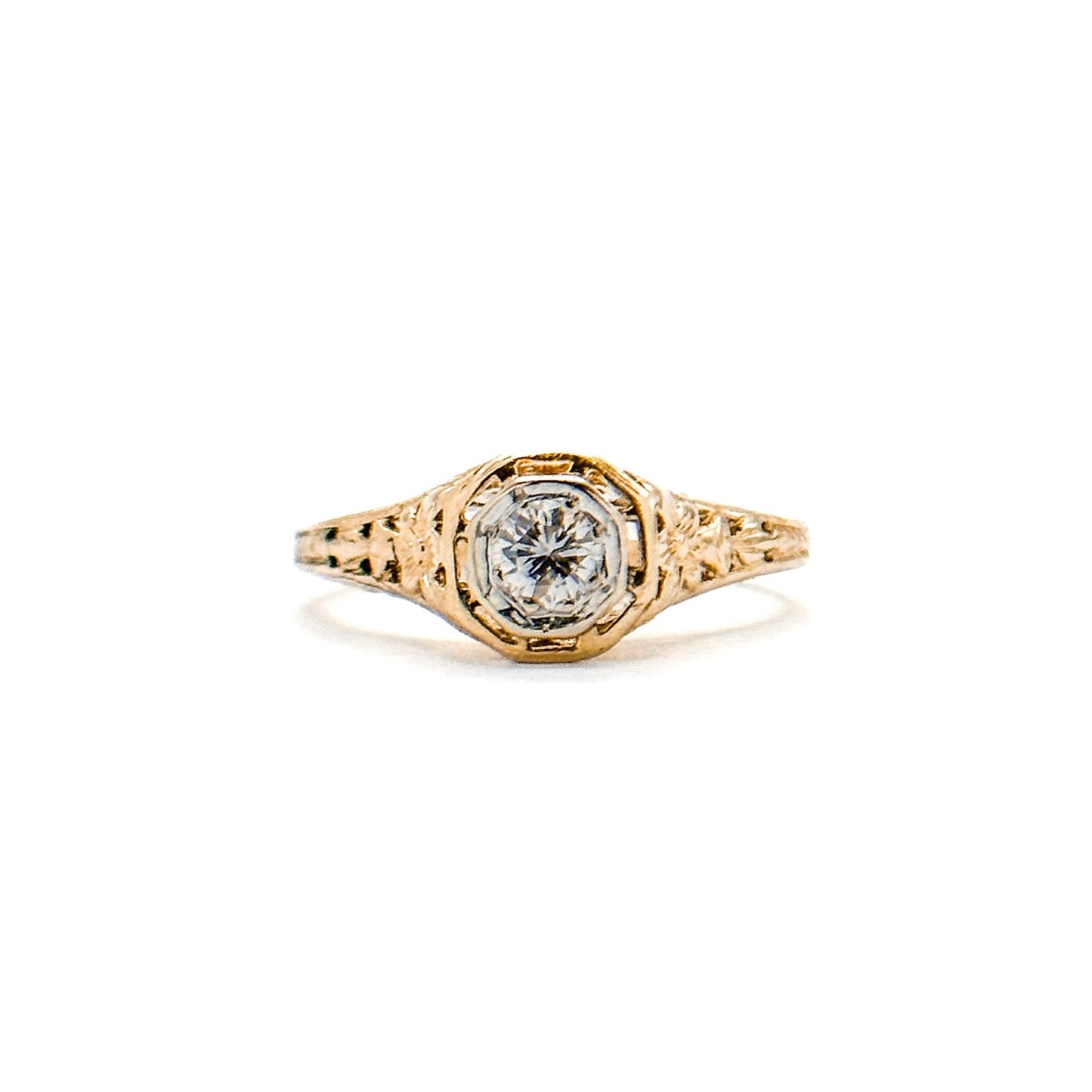 Antique Art Deco Diamond Filigree Ring. Featuring a dazzling diamond amidst an intricately detailed filigree design.
