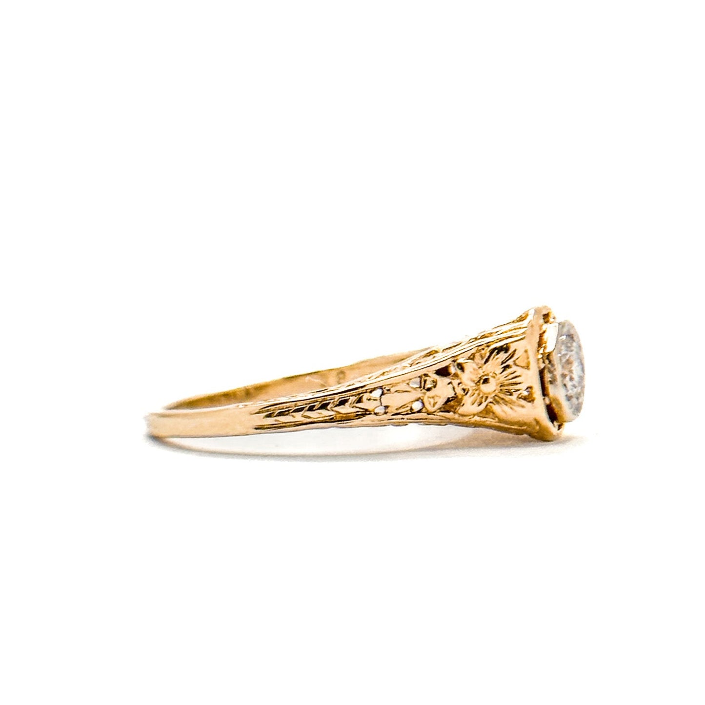 Antique Art Deco Diamond Filigree Ring. Featuring a dazzling diamond amidst an intricately detailed filigree design.