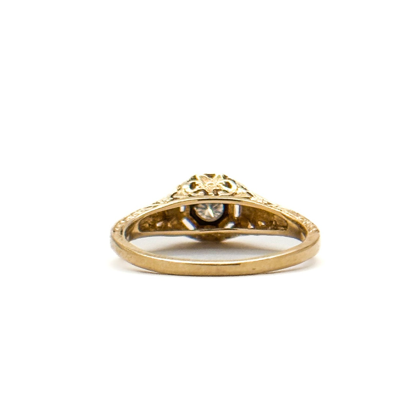 Antique Art Deco Diamond Filigree Ring. Featuring a dazzling diamond amidst an intricately detailed filigree design.