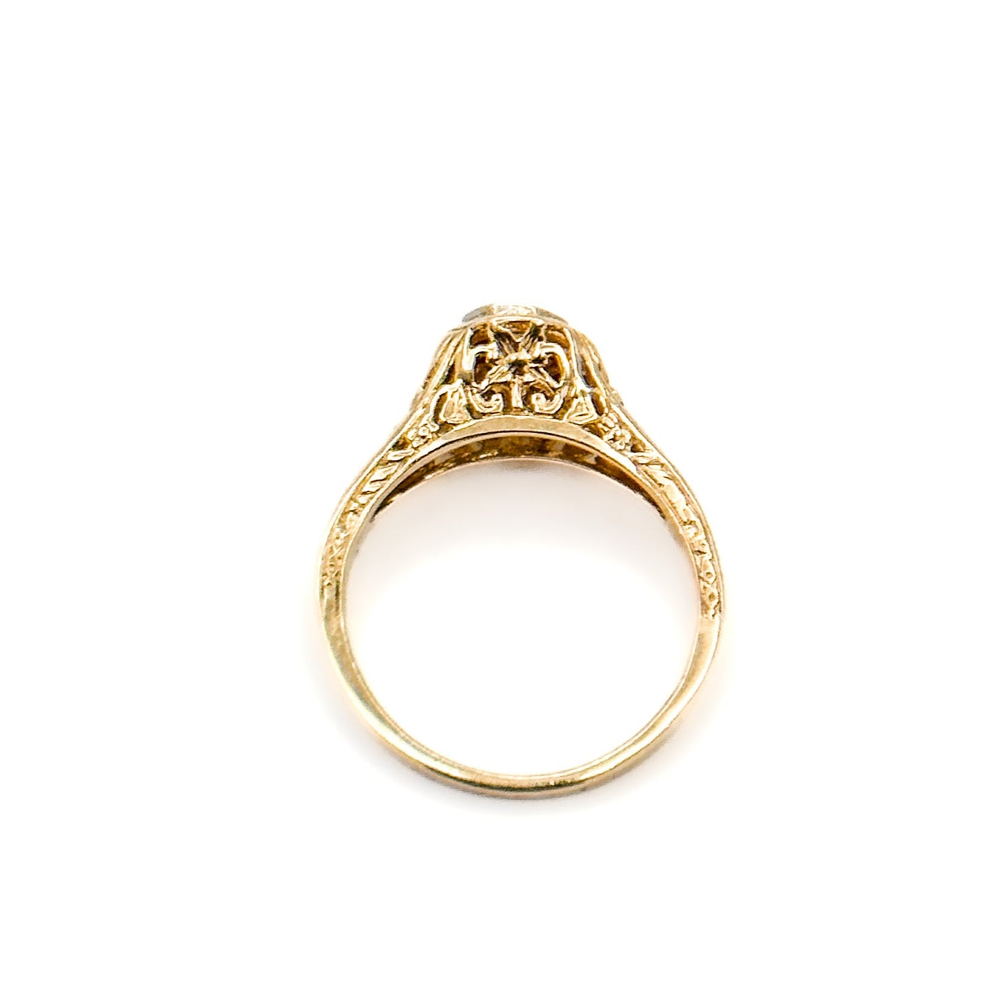 Antique Art Deco Diamond Filigree Ring. Featuring a dazzling diamond amidst an intricately detailed filigree design.