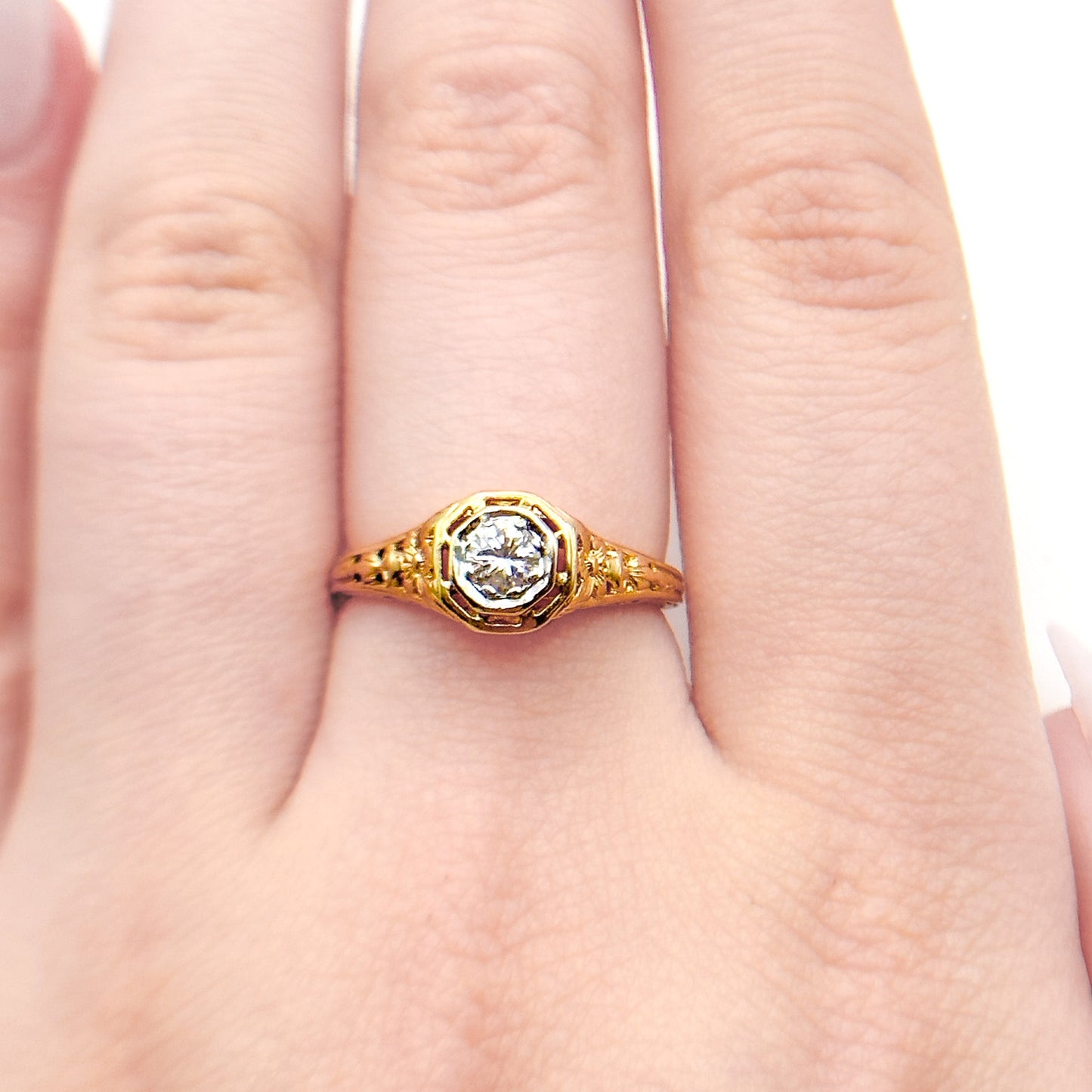 Antique Art Deco Diamond Filigree Ring. Featuring a dazzling diamond amidst an intricately detailed filigree design.