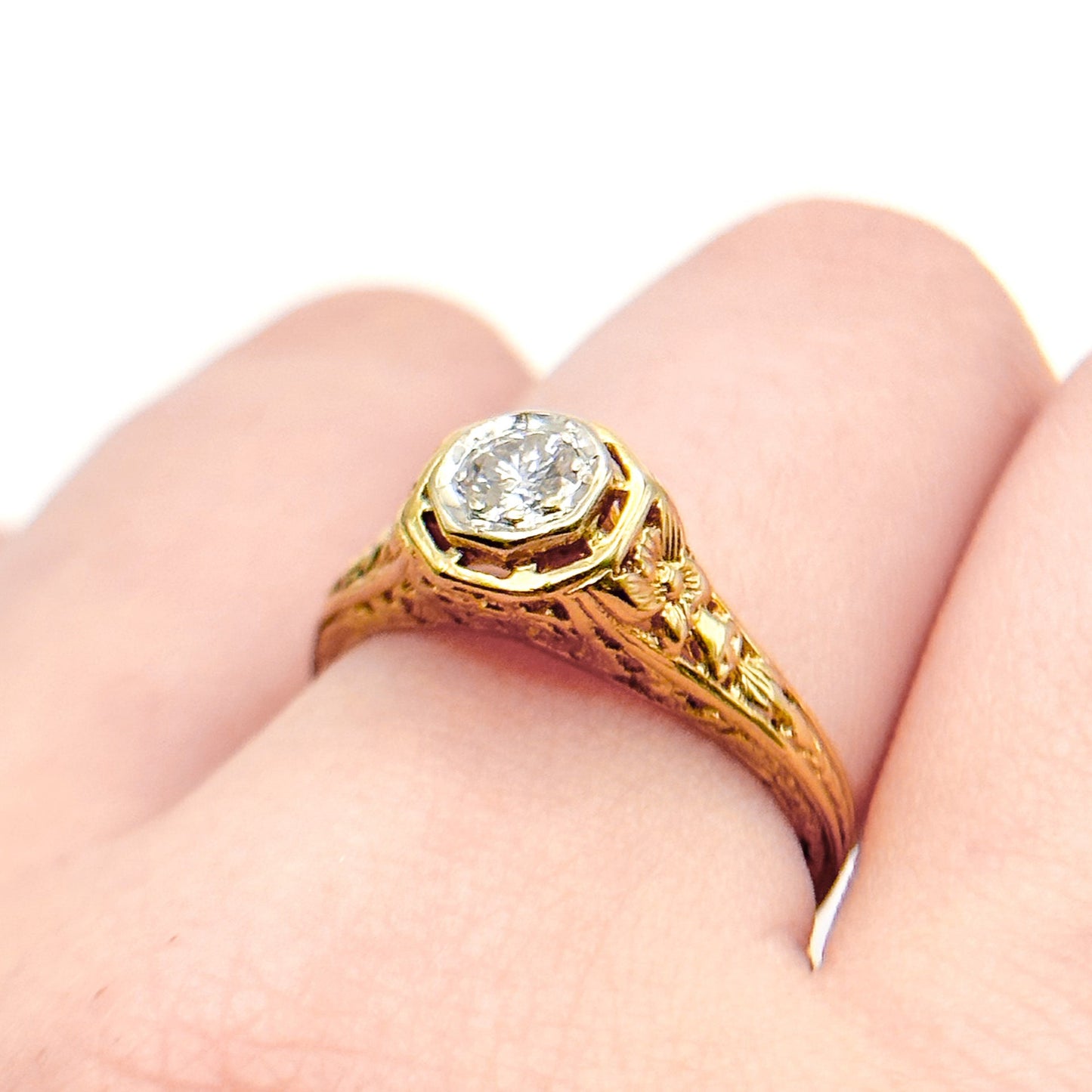 Antique Art Deco Diamond Filigree Ring. Featuring a dazzling diamond amidst an intricately detailed filigree design.