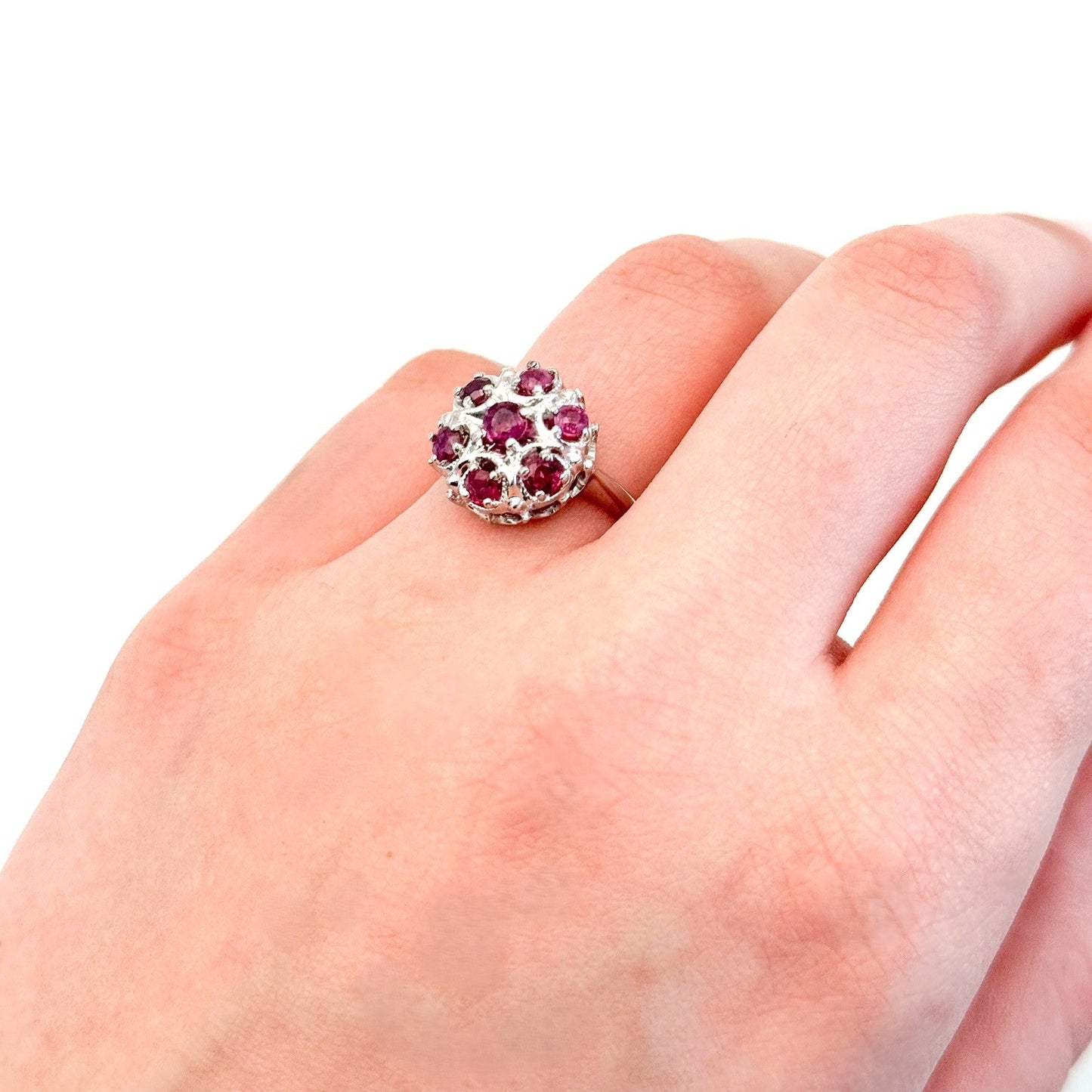 Vintage ruby ring, mid-century cluster ring, 14K white gold floral ring on finger, retro cocktail ring, ruby statement ring, antique-inspired jewelry, estate jewelry, heirloom gemstone ring.