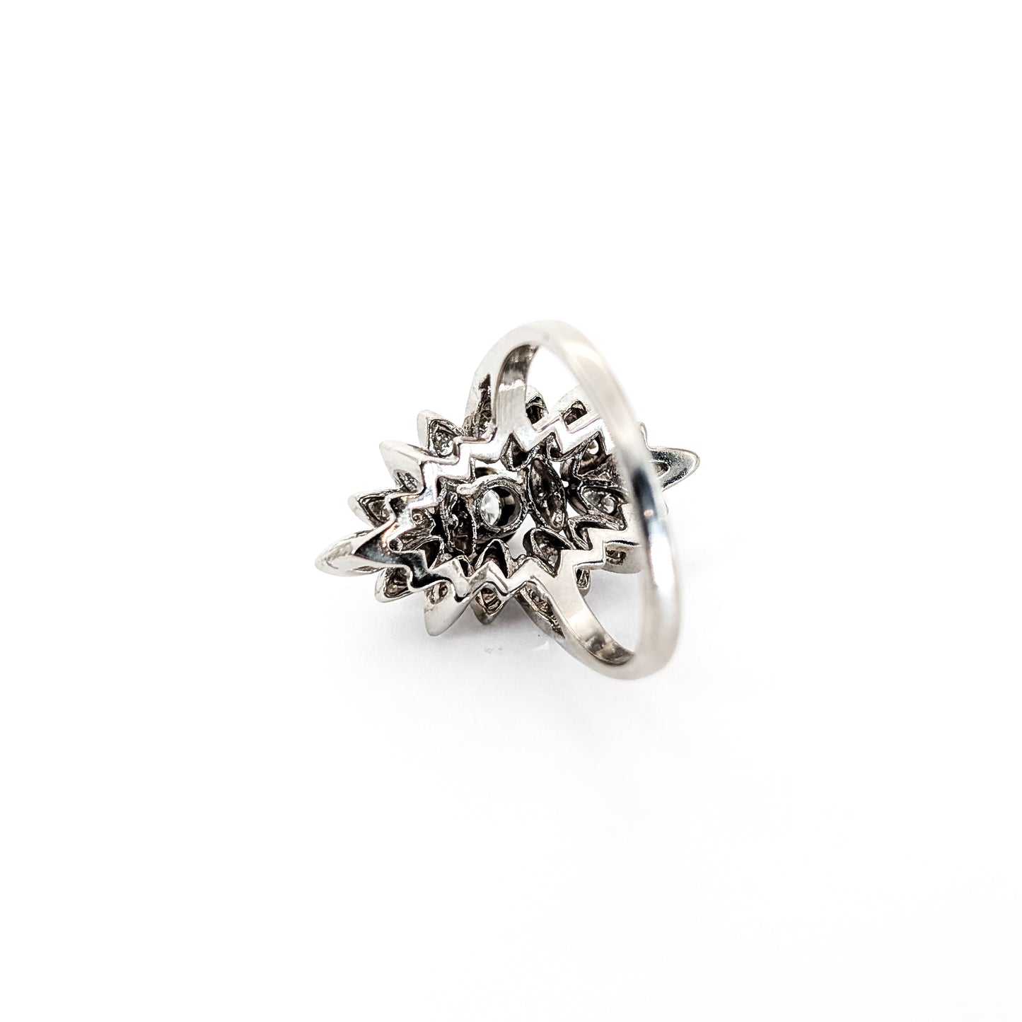 Luminous 14K white gold ring , the design features a brilliant round center diamond surrounded by an intricate halo of marquise-shaped with round diamond accents