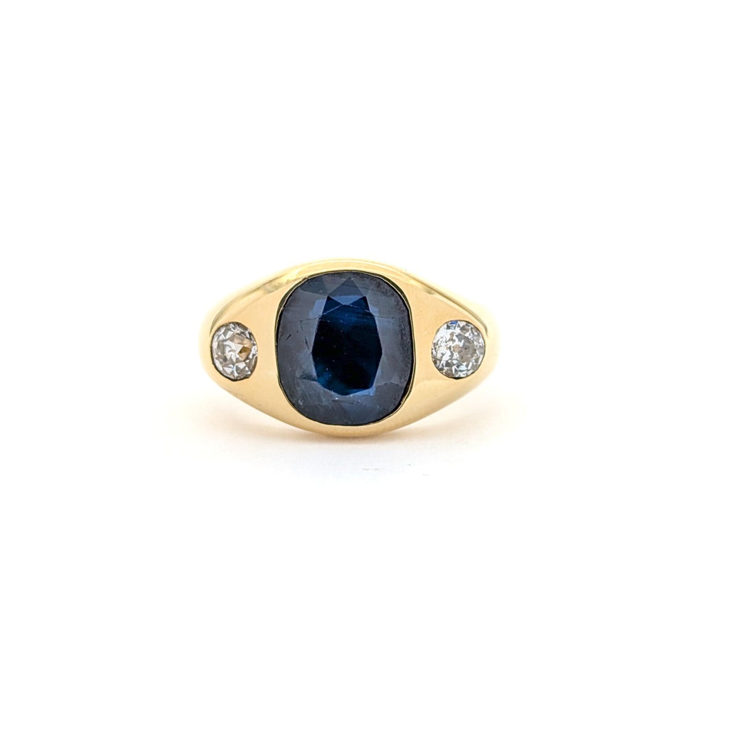 Italian crafted Antique Cushion Cut Blue Sapphire and Old Mine Cut Diamonds Dome Ring in 18K Gold with white background.