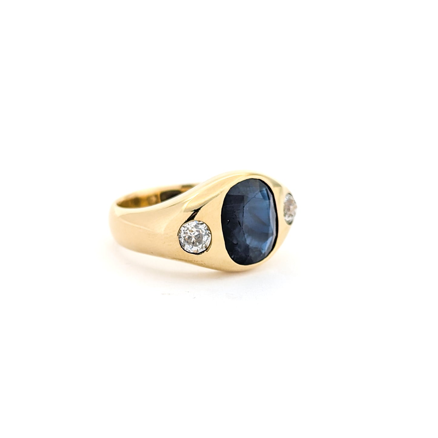 Italian crafted Antique Cushion Cut Blue Sapphire and Old Mine Cut Diamonds Dome Ring in 18K Gold with white background.