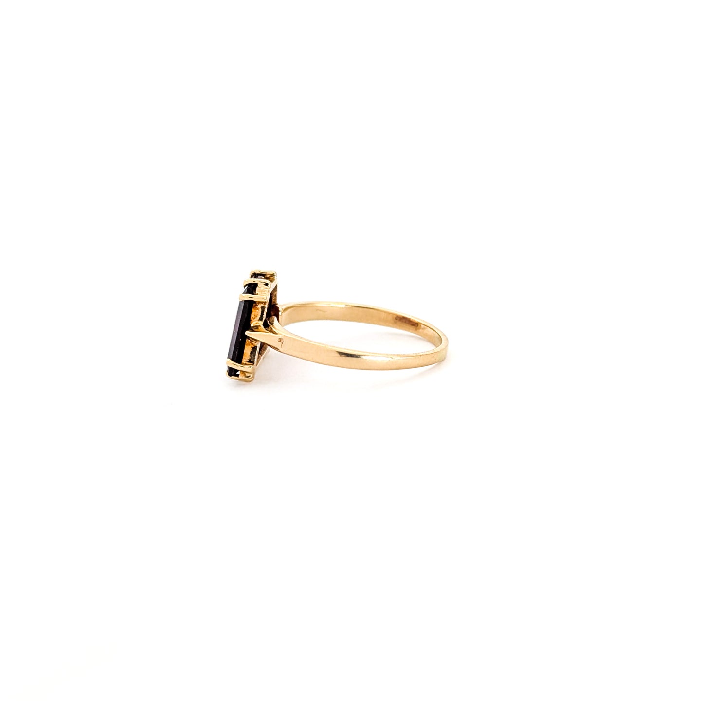 14K Gold garnet ring, cut into a striking trapezoid shape, on a white background