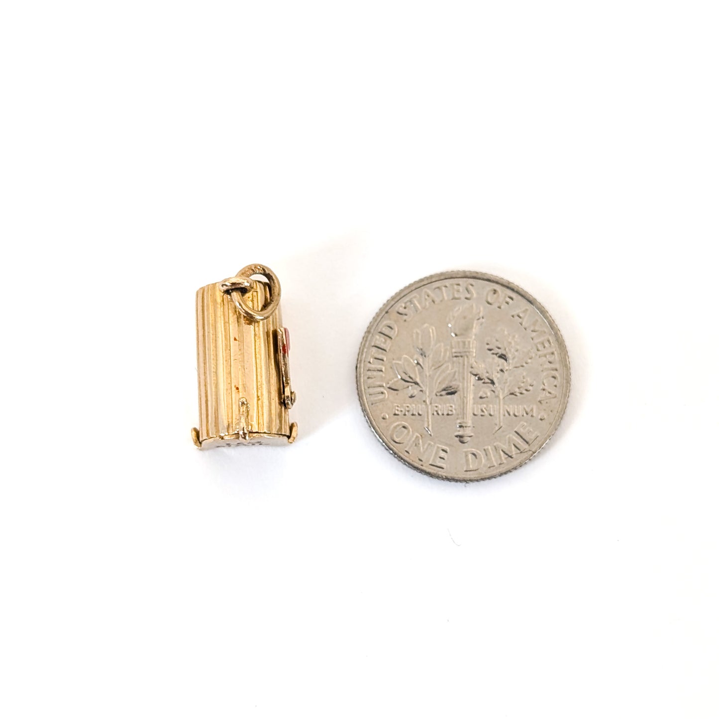 14k Gold U.S. Mail mailbox charm with enamel detailing, next to a dime on a white background