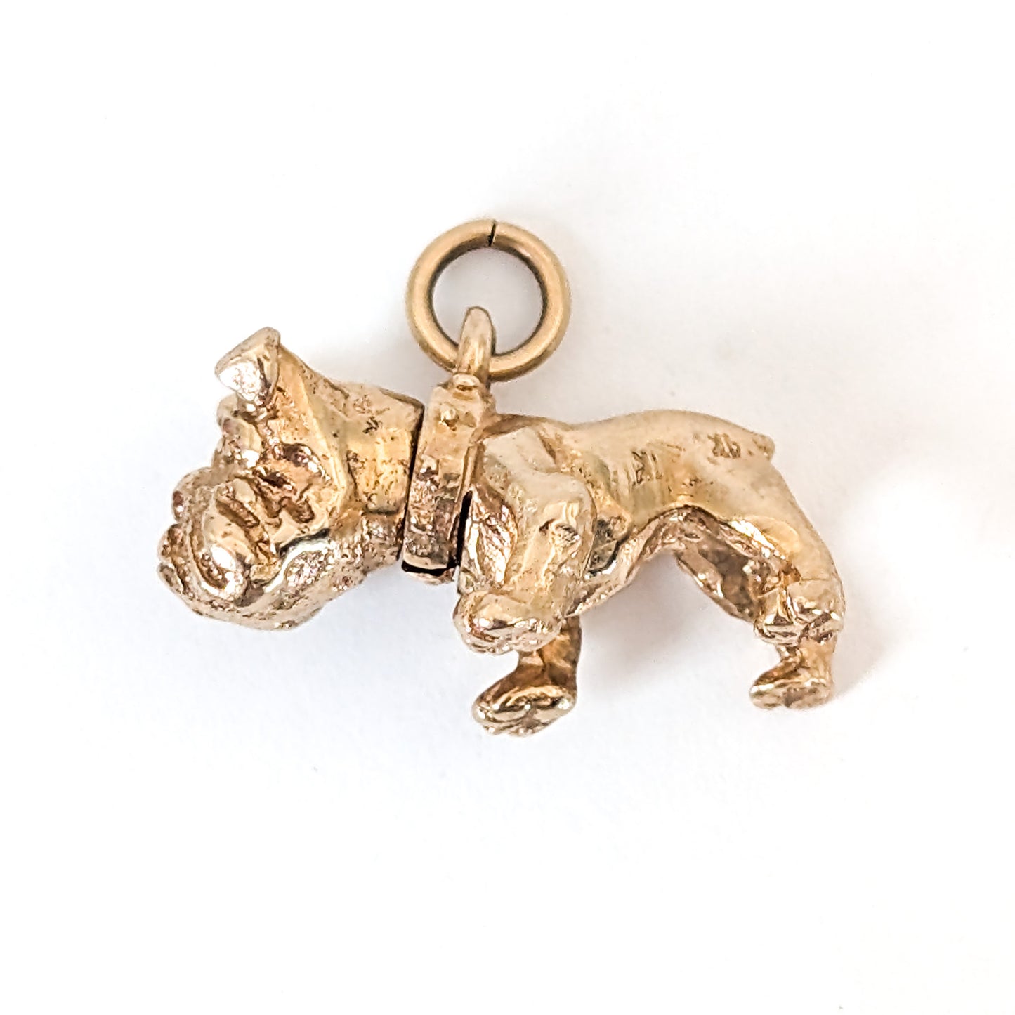 Vintage 14k Gold bulldog mechanical charm on a white background