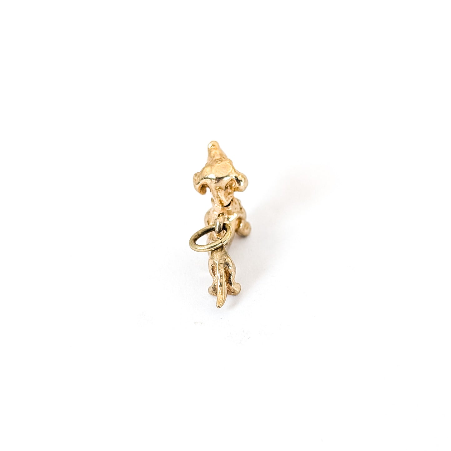 14K Gold dachshund mechanical charm on a white background