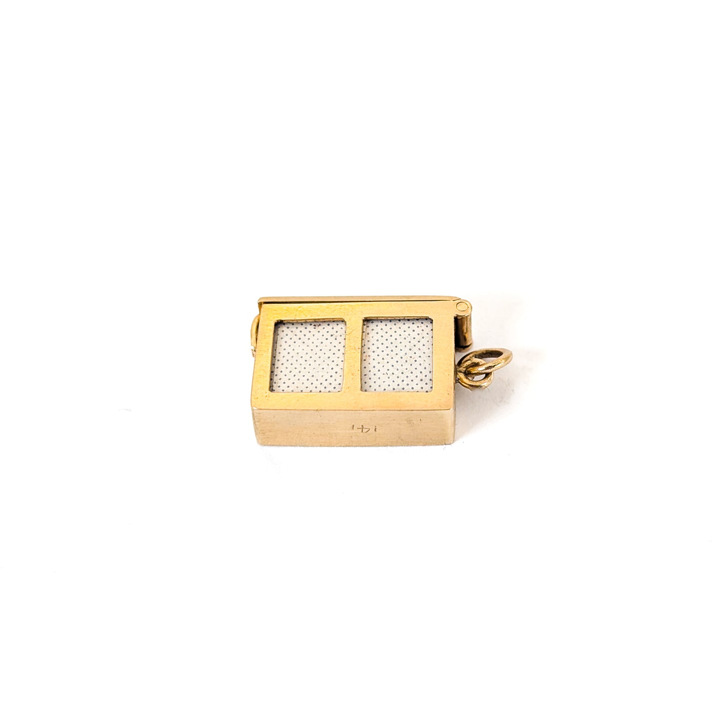 14k gold vintage mechanical charm with enameled card suit symbols and a real deck of cards on a white background