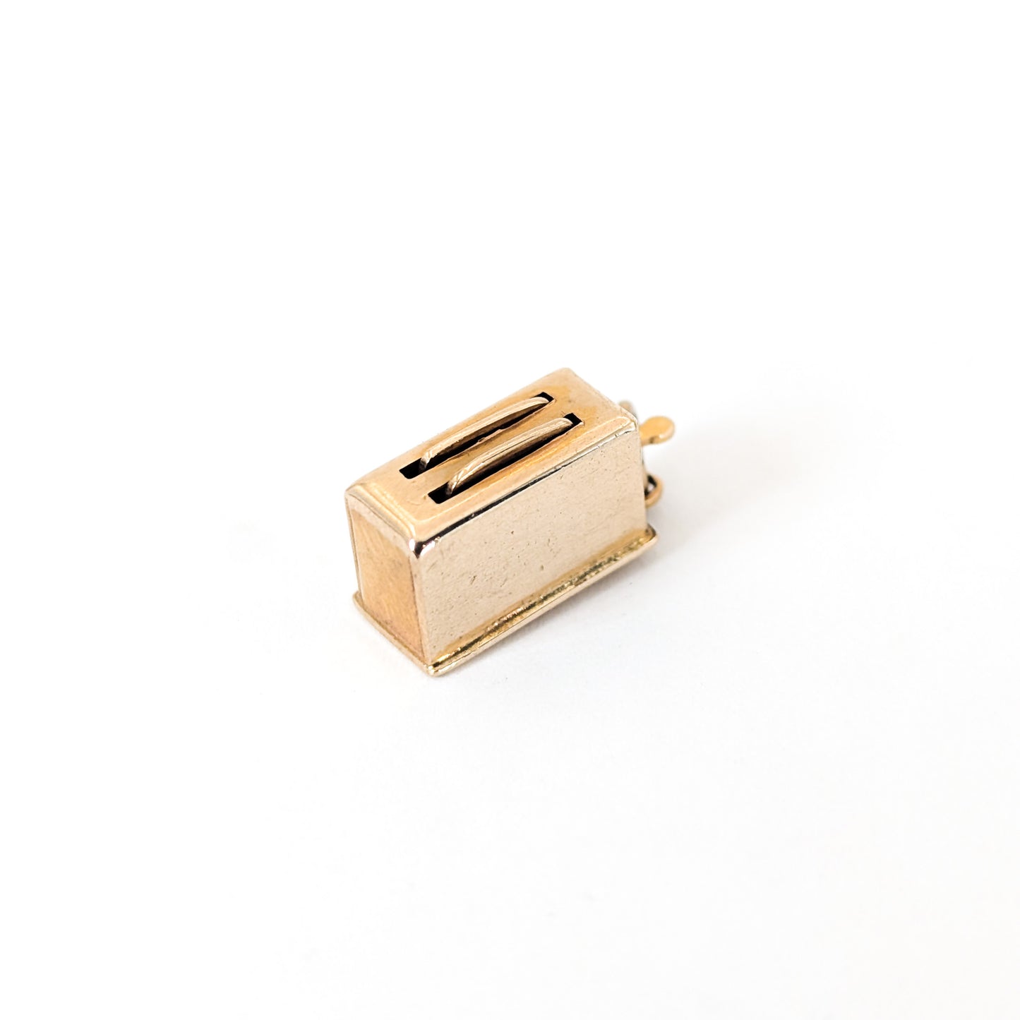 14k Gold toaster mechanical charm on a white background