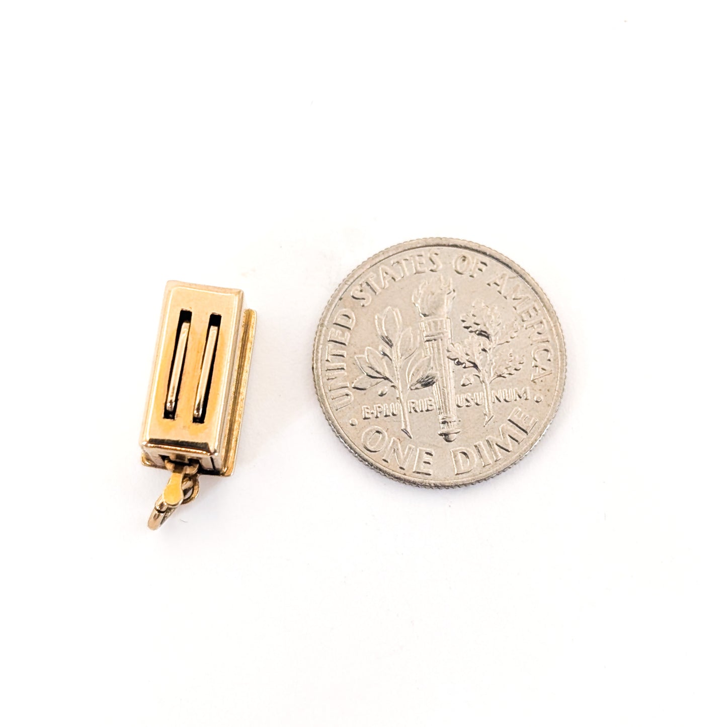 14k Gold toaster mechanical charm next to a U.S. dime on a white background