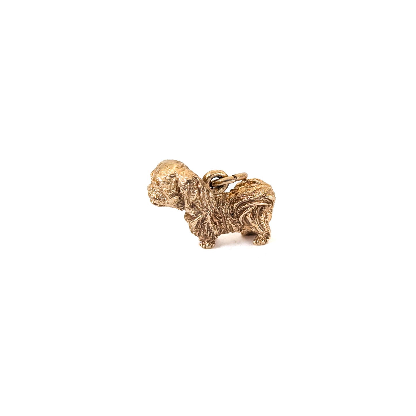 14k Gold Vintage Pekingese mechanical charm on a white background