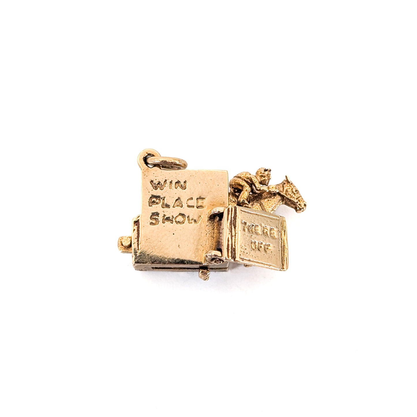 14k gold horse racing mechanical charm with spring action on a white background