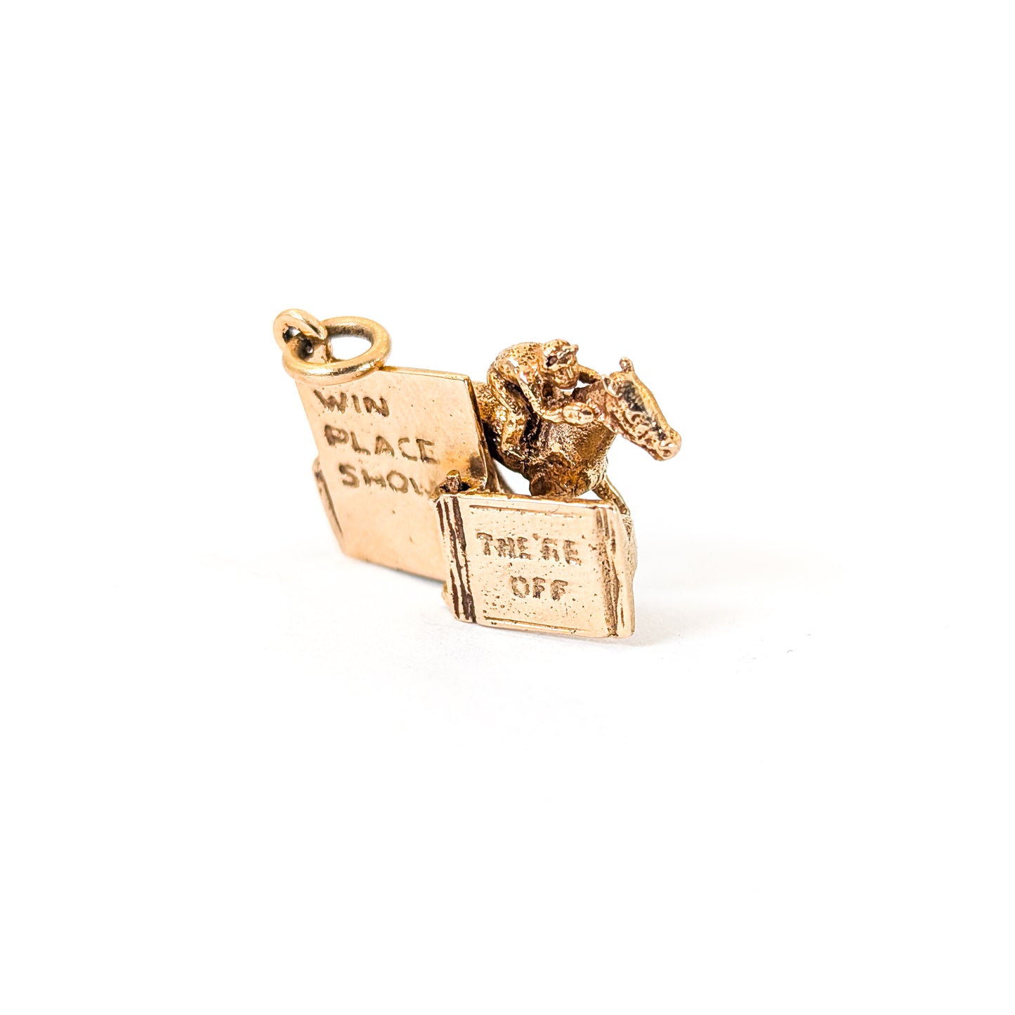 14k gold horse racing mechanical charm with spring action on a white background