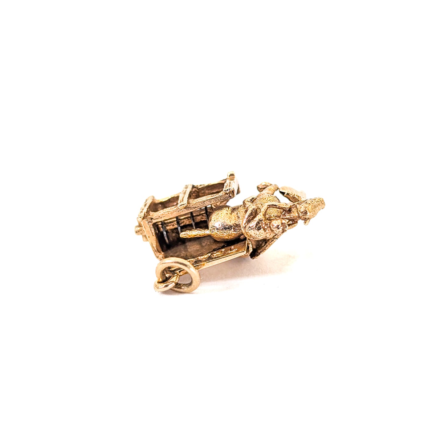 14k gold horse racing mechanical charm with spring action on a white background