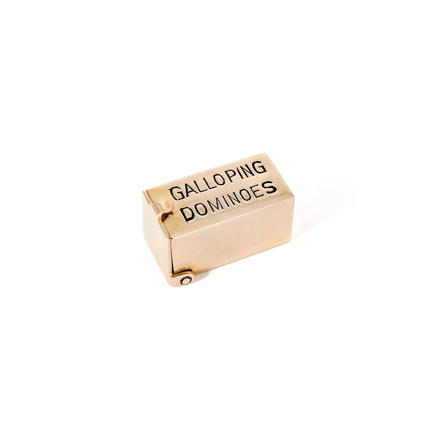 14K Gold mechanical charm pendent with 'Galloping Dominoes' text and with hidden Bakelite dice on a white background