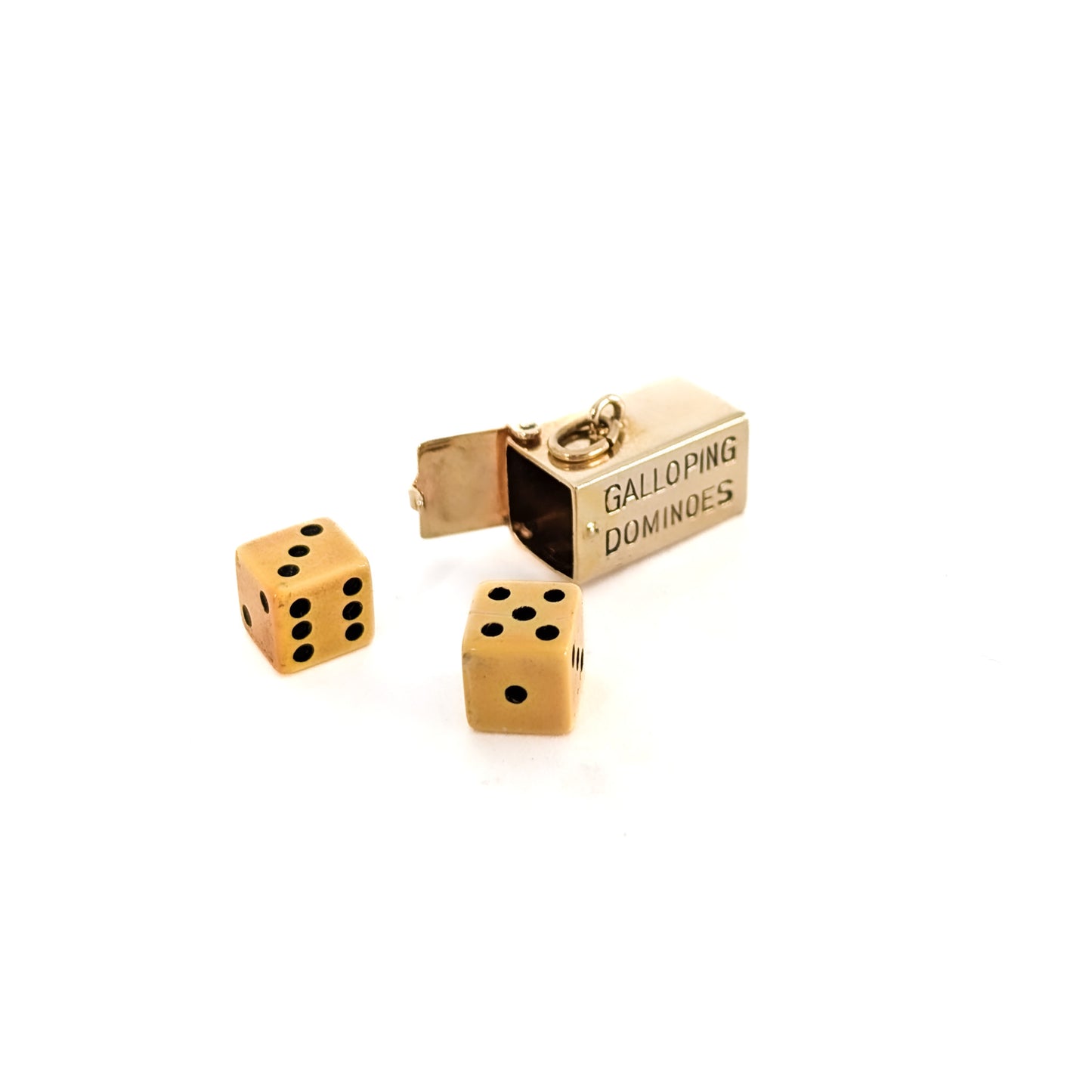 14K Gold mechanical charm pendent with 'Galloping Dominoes' text and with hidden Bakelite dice on a white background