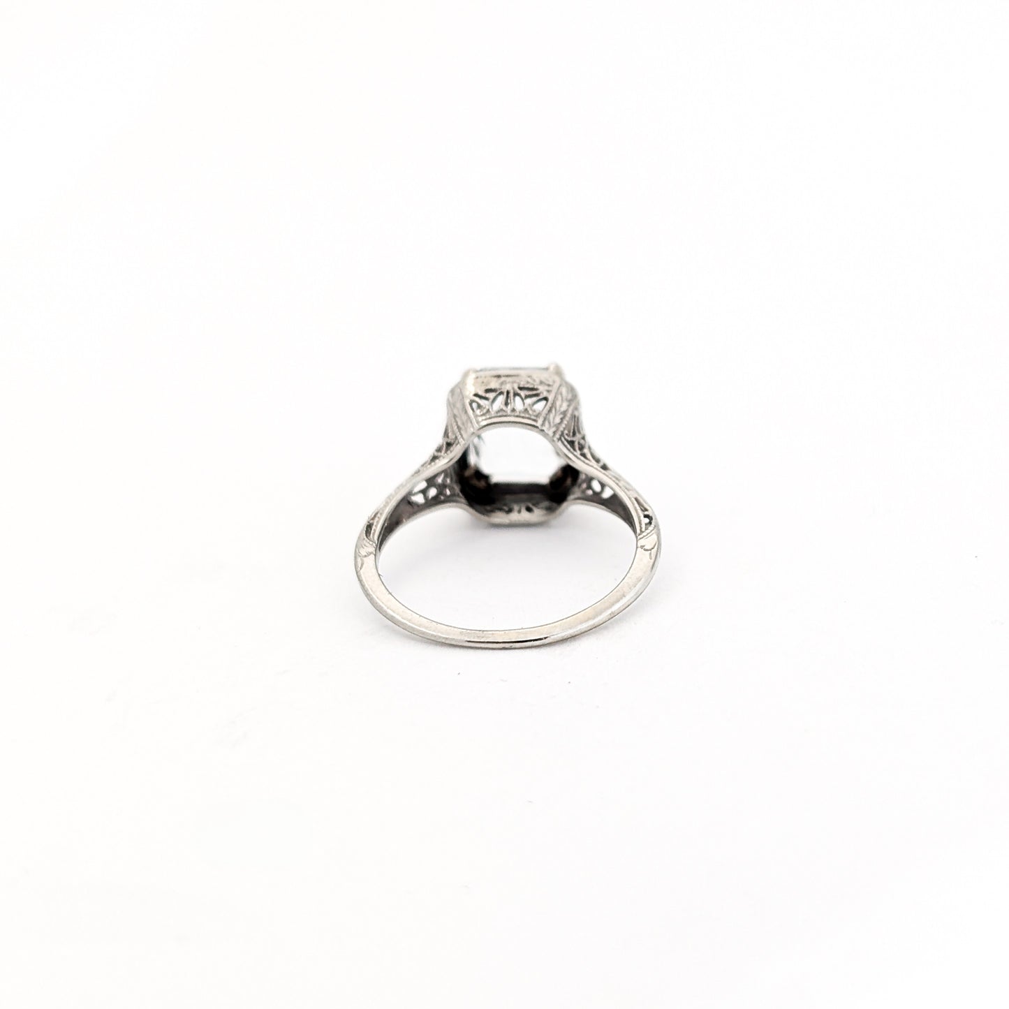 18k white gold ring with a rectangular aquamarine gemstone on a white background