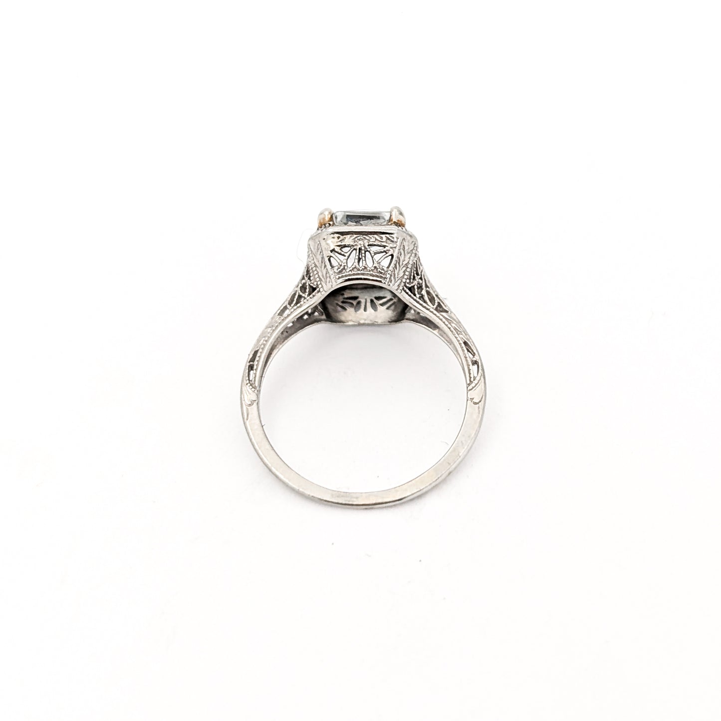 18k white gold ring with a rectangular aquamarine gemstone on a white background