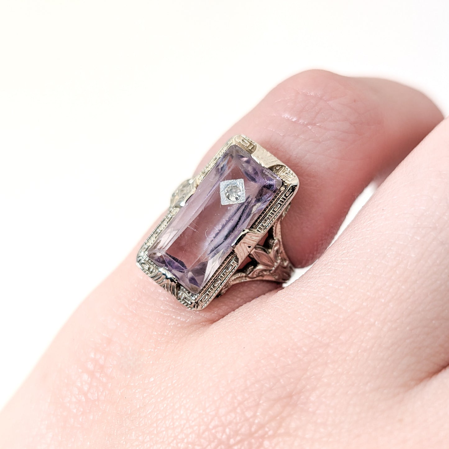 18K White Gold Ring with Amethyst and Diamond gemstones on a white background