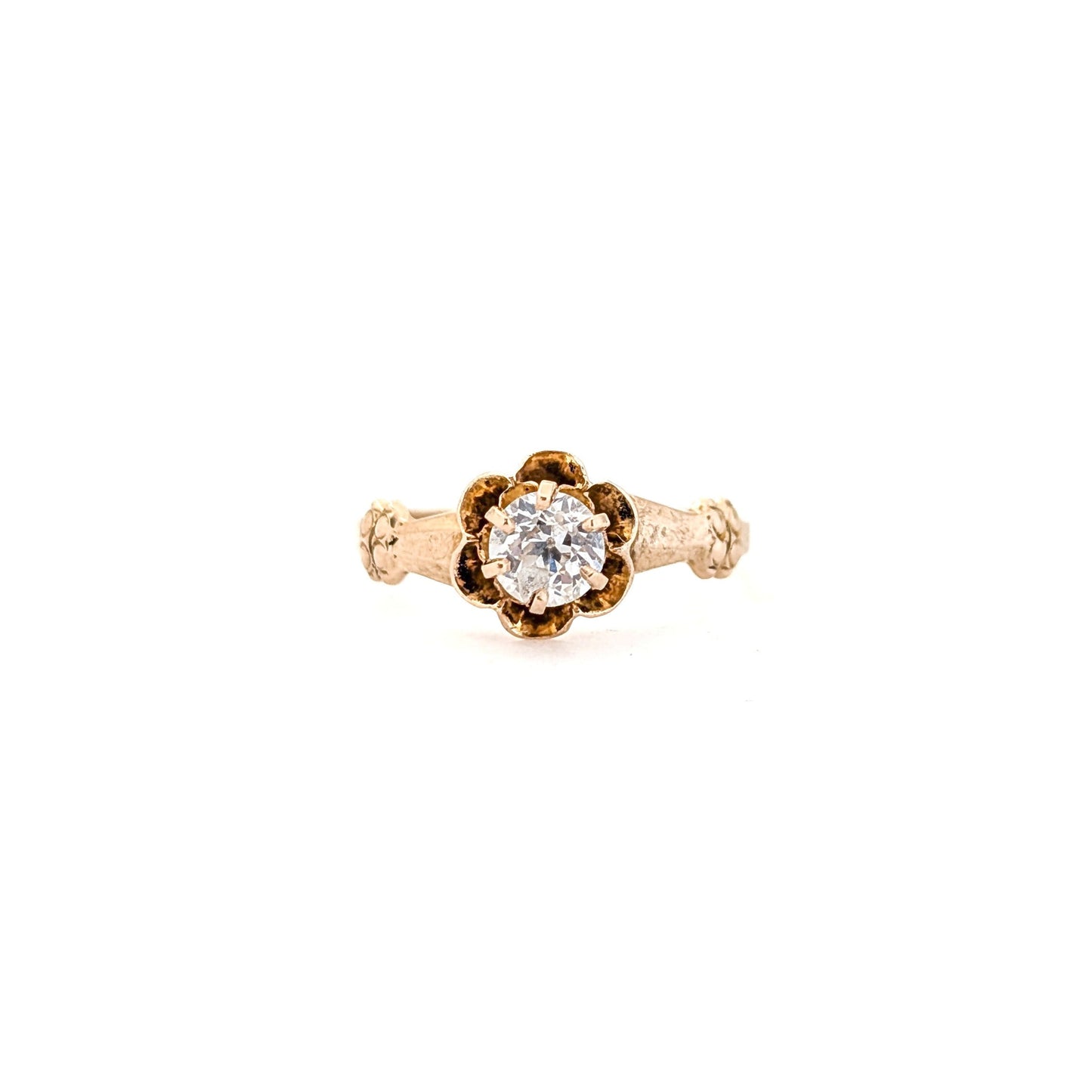 10k Gold ring with a diamond on a white background