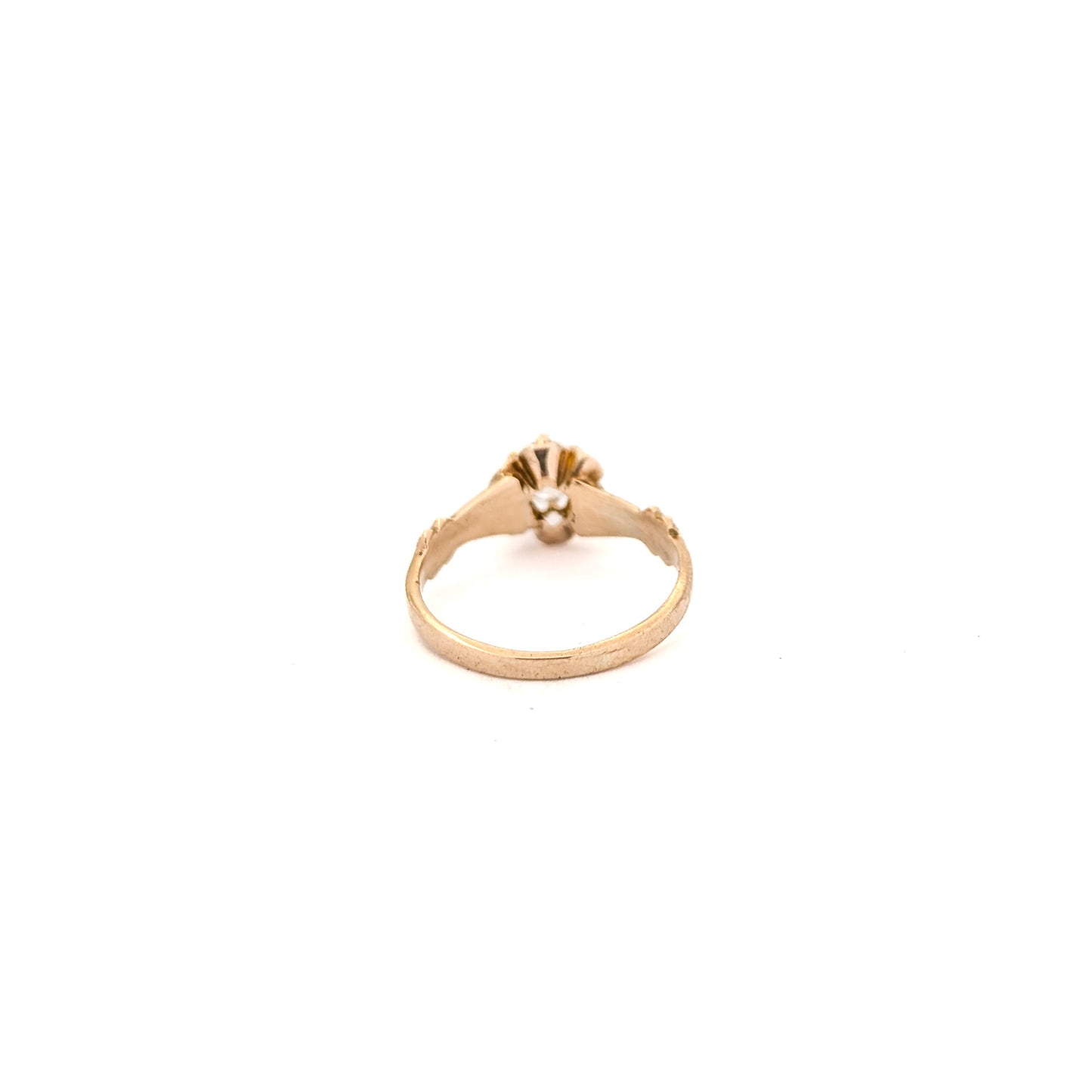 10k Gold ring with a diamond on a white background