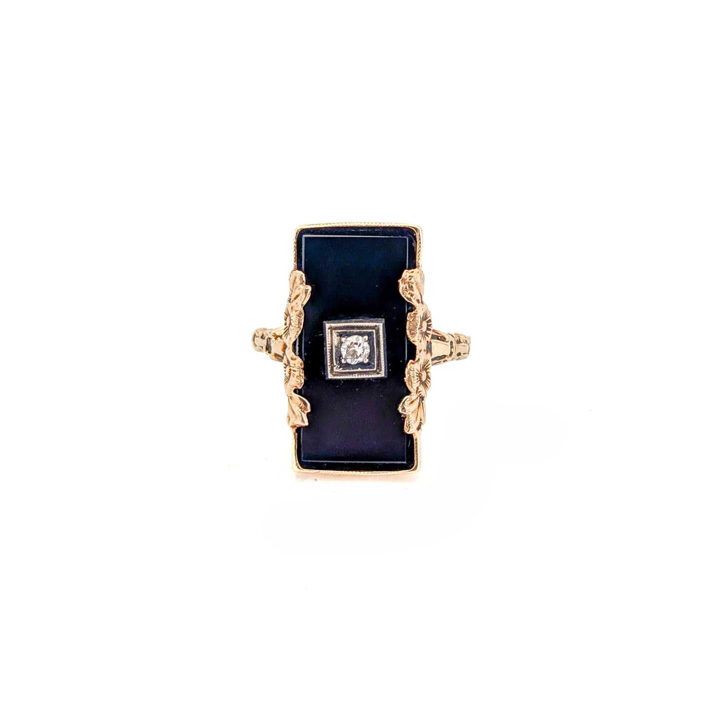 10K Gold Onyx ring with a central diamond on a white background