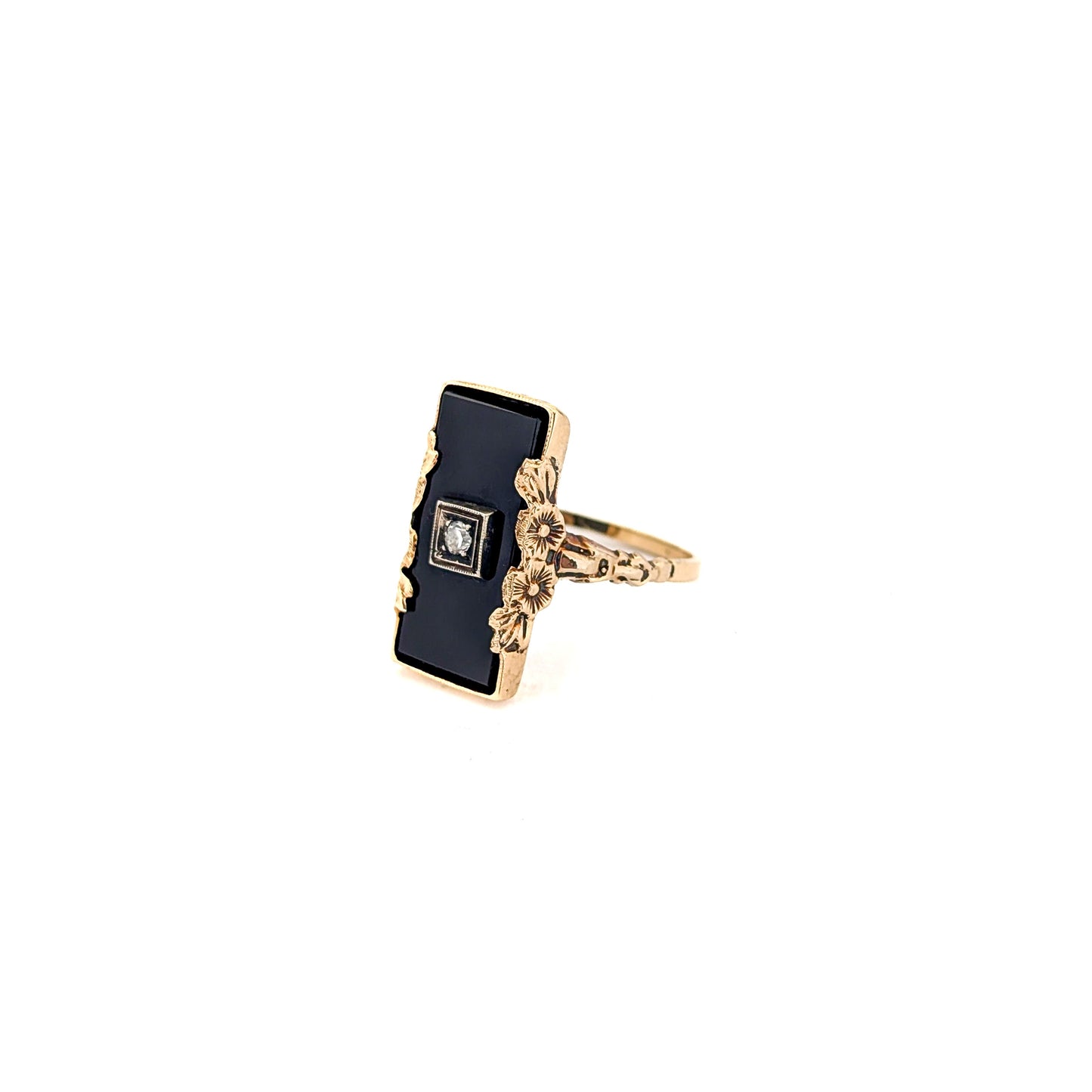 10K Gold Onyx ring with a central diamond on a white background