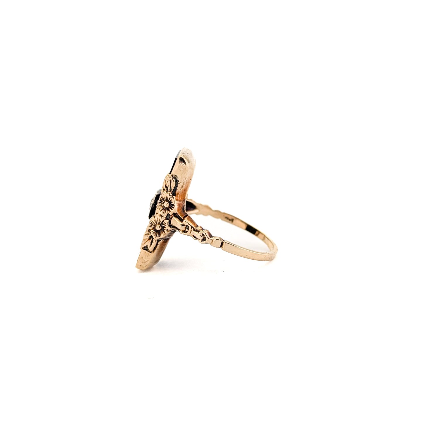 10K Gold Onyx ring with a central diamond on a white background