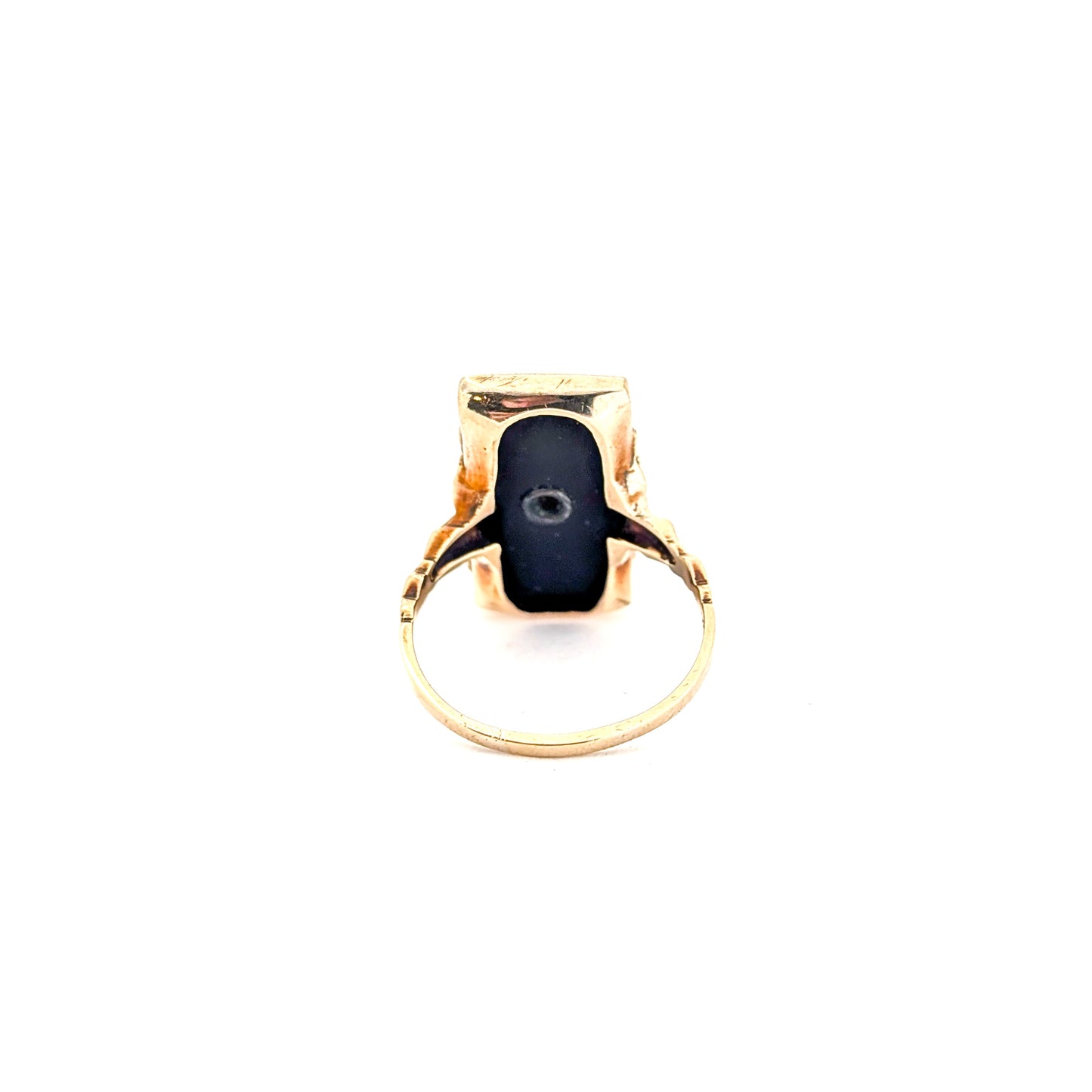 10K Gold Onyx ring with a central diamond on a white background