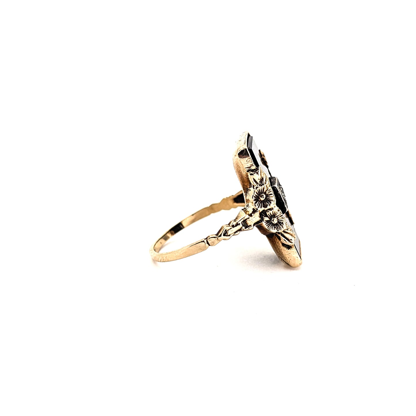 10K Gold Onyx ring with a central diamond on a white background