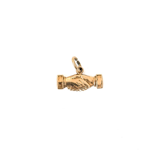14K Gold handshake charm on a white background