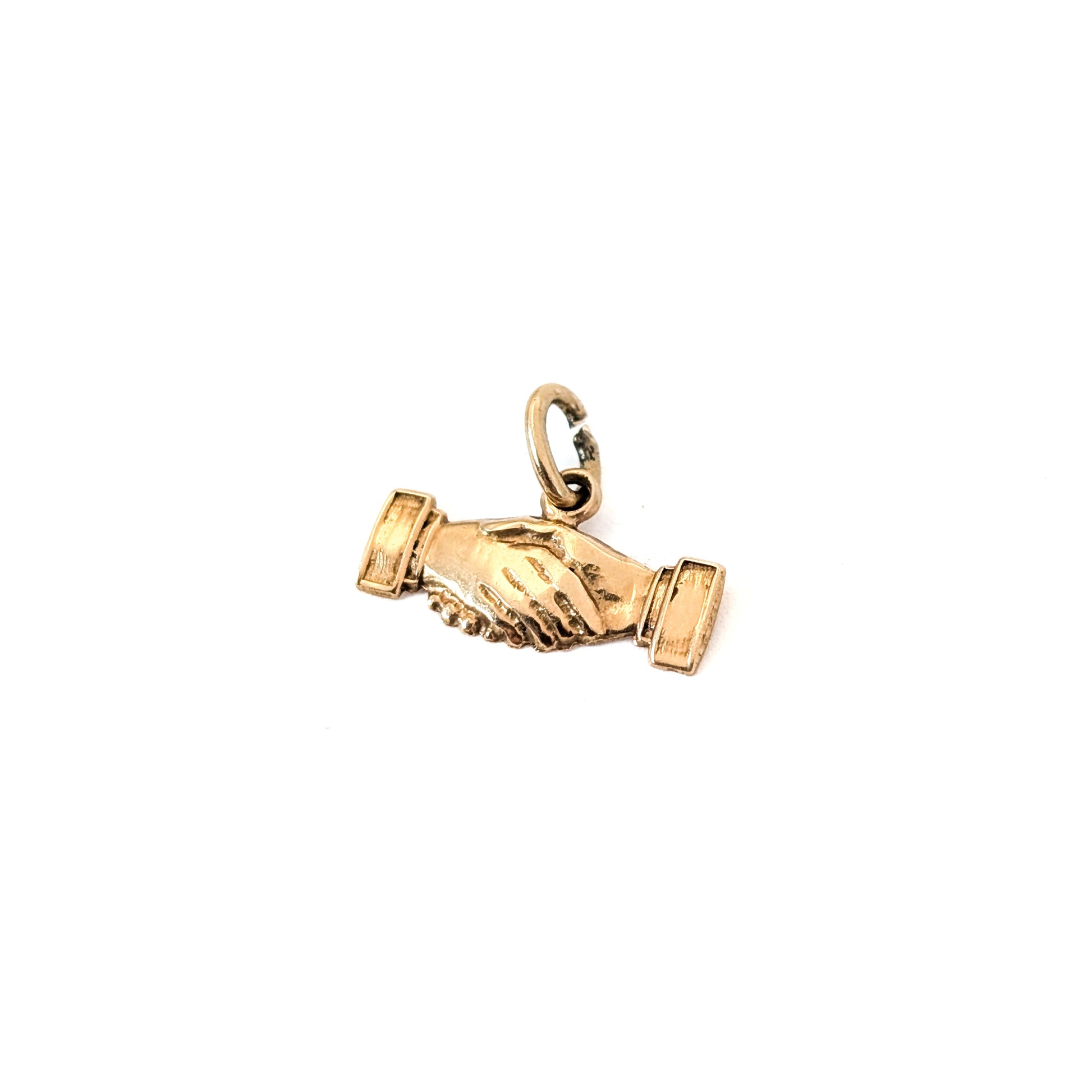 14K Gold handshake charm on a white background
