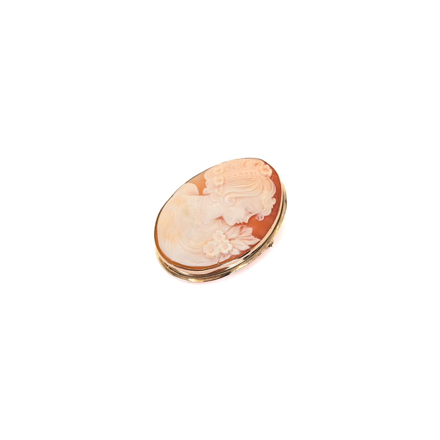 9k gold cameo brooch with a classical design on a white background
