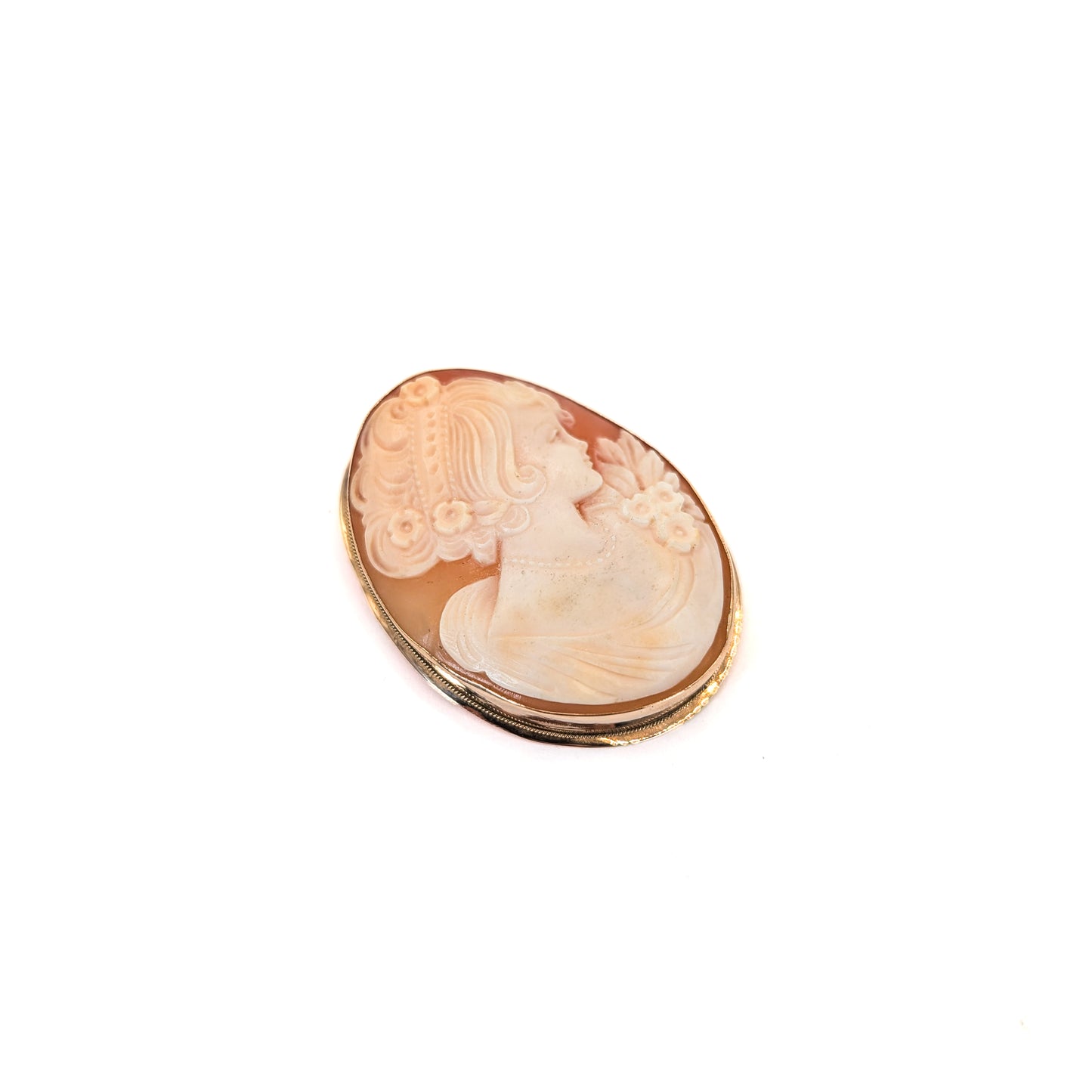 9k gold cameo brooch with a classical design on a white background